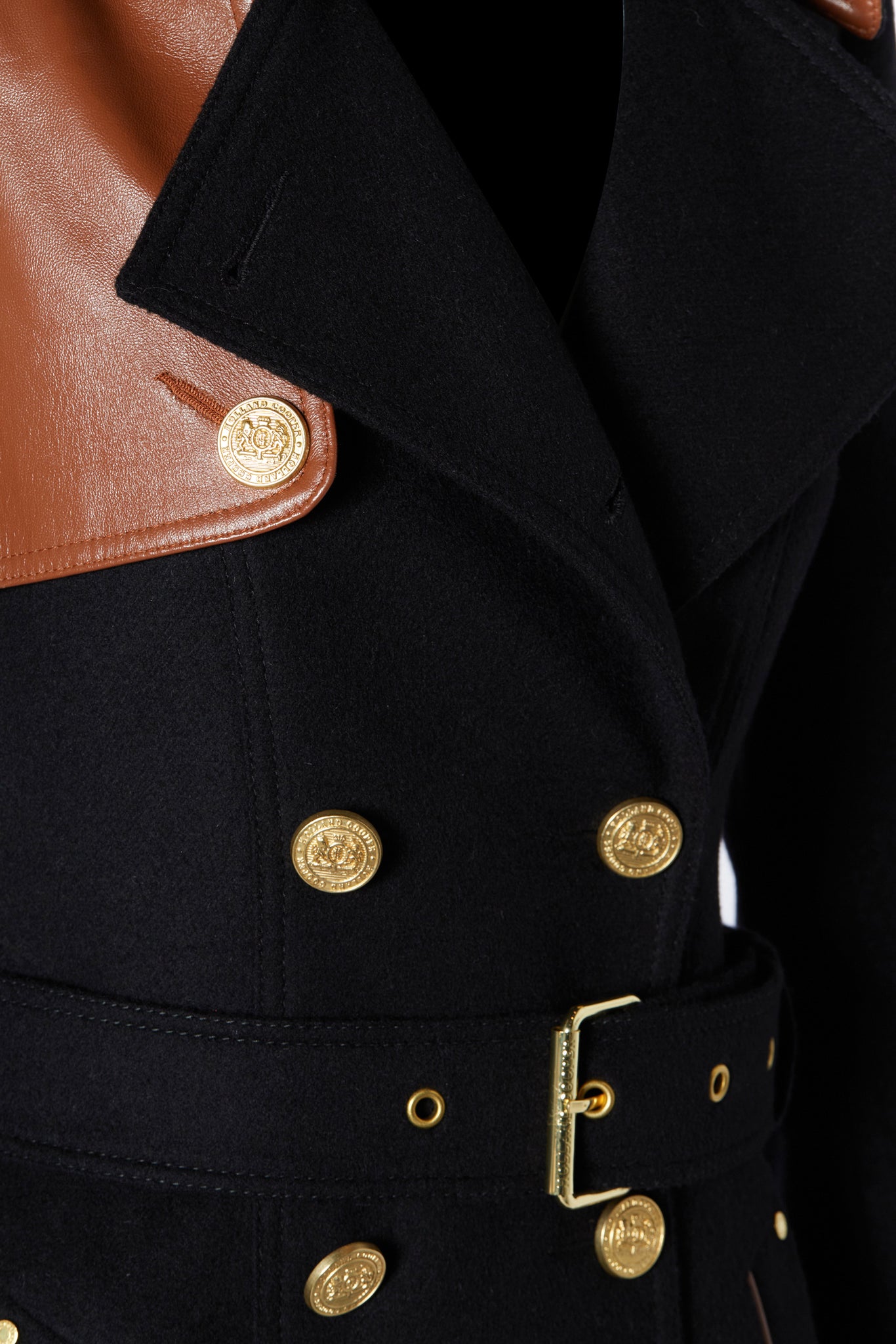 gold button and belt detail on womens black wool and tan leather double breasted full length trench coat 