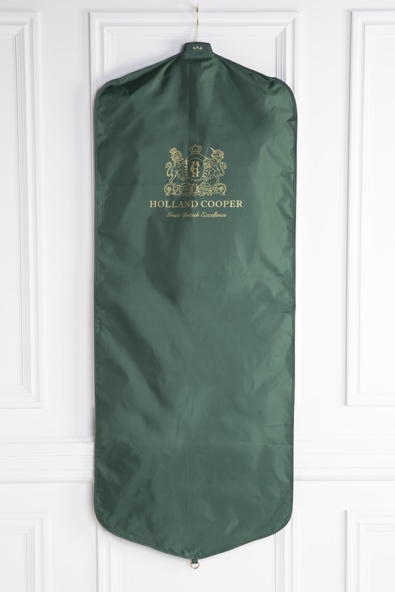 green garment bag that comes alongside every tailored piece