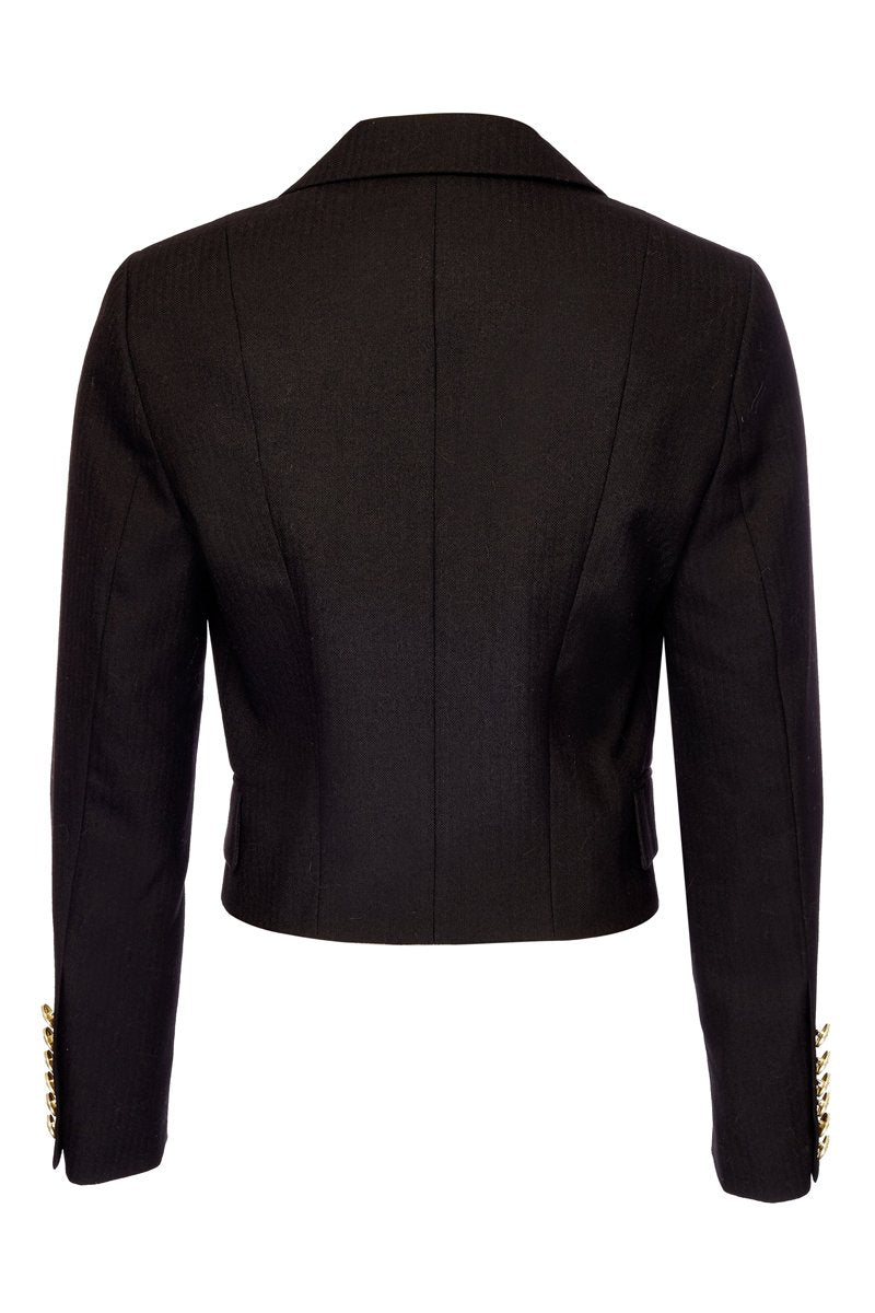 back of British made tailored cropped jacket in black with welt pockets and gold button detail down the front and on sleeves