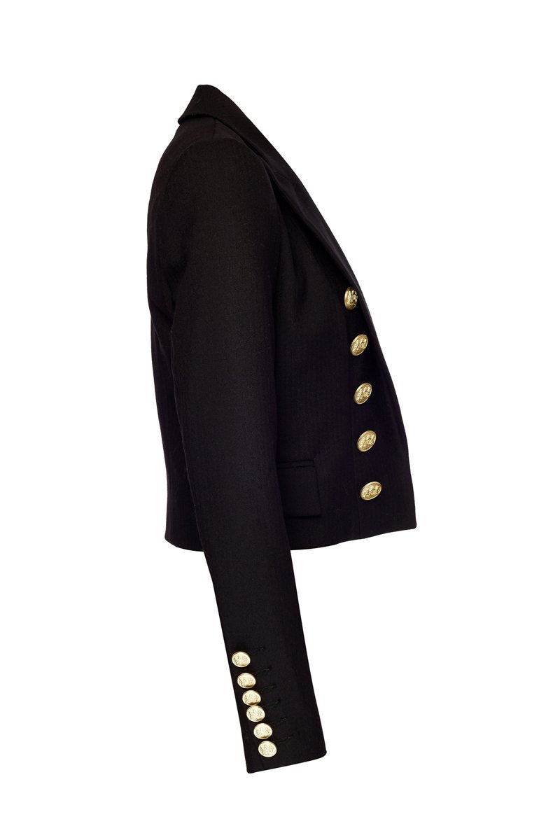 side of British made tailored cropped jacket in black with welt pockets and gold button detail down the front and on sleeves