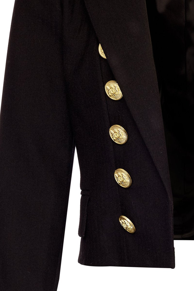 gold button detail on front of British made tailored cropped jacket in black with welt pockets and gold button detail down the front and on sleeves