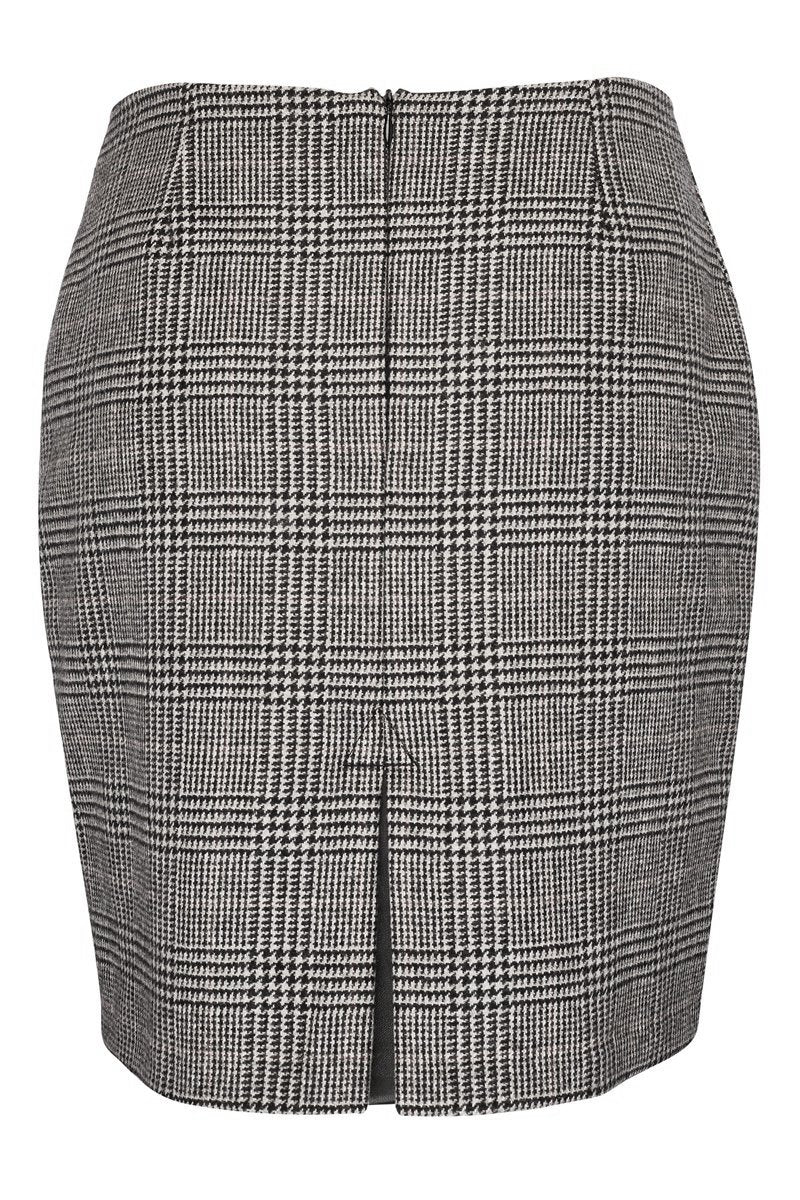 back of womens wool tweed pencil mini skirt in black and white check with slit on back and zip fastening on centre back