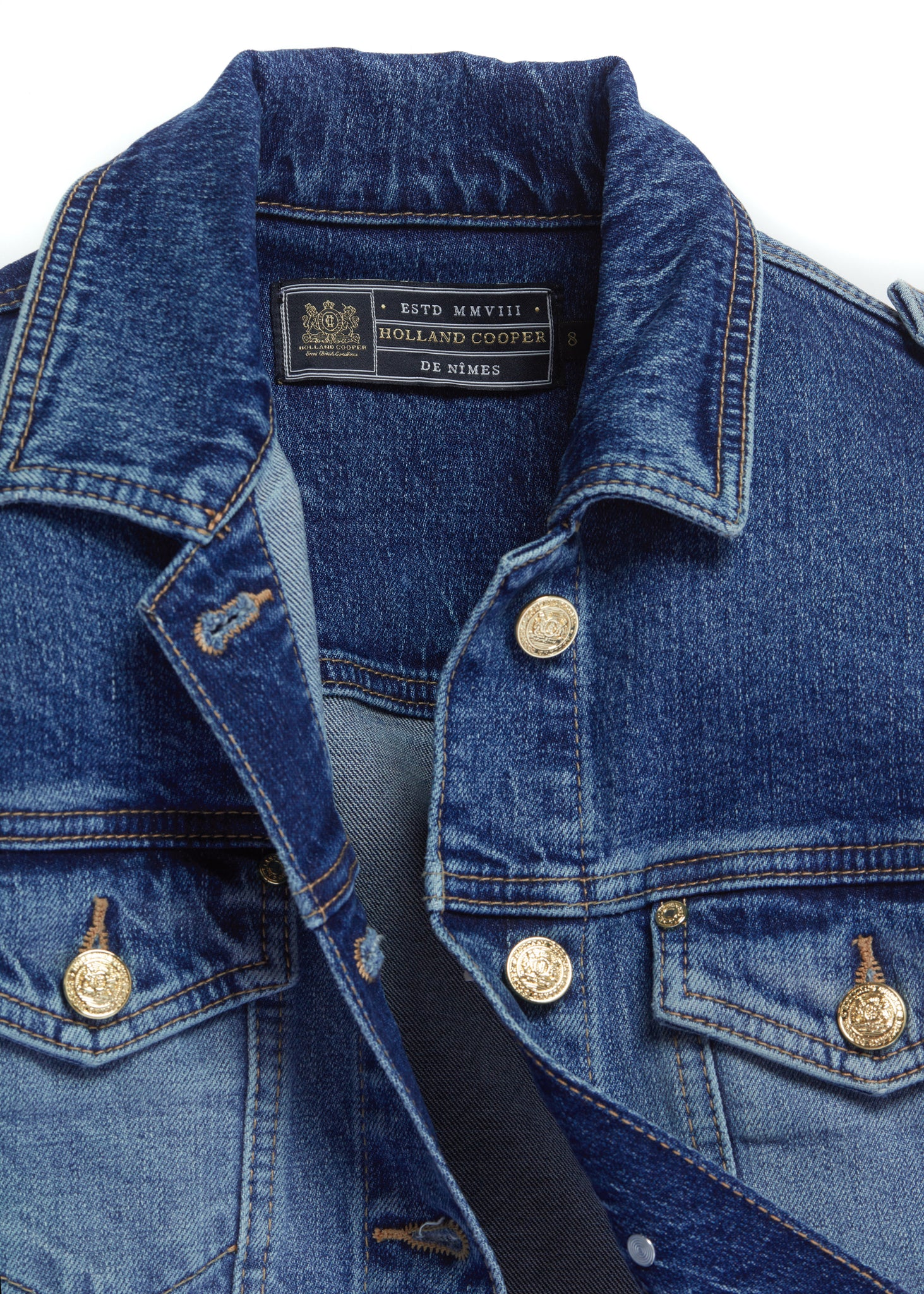 classic indigo denim jacket waist length with gold buttons on front, pockets and cuffs with holland cooper embroidery on back