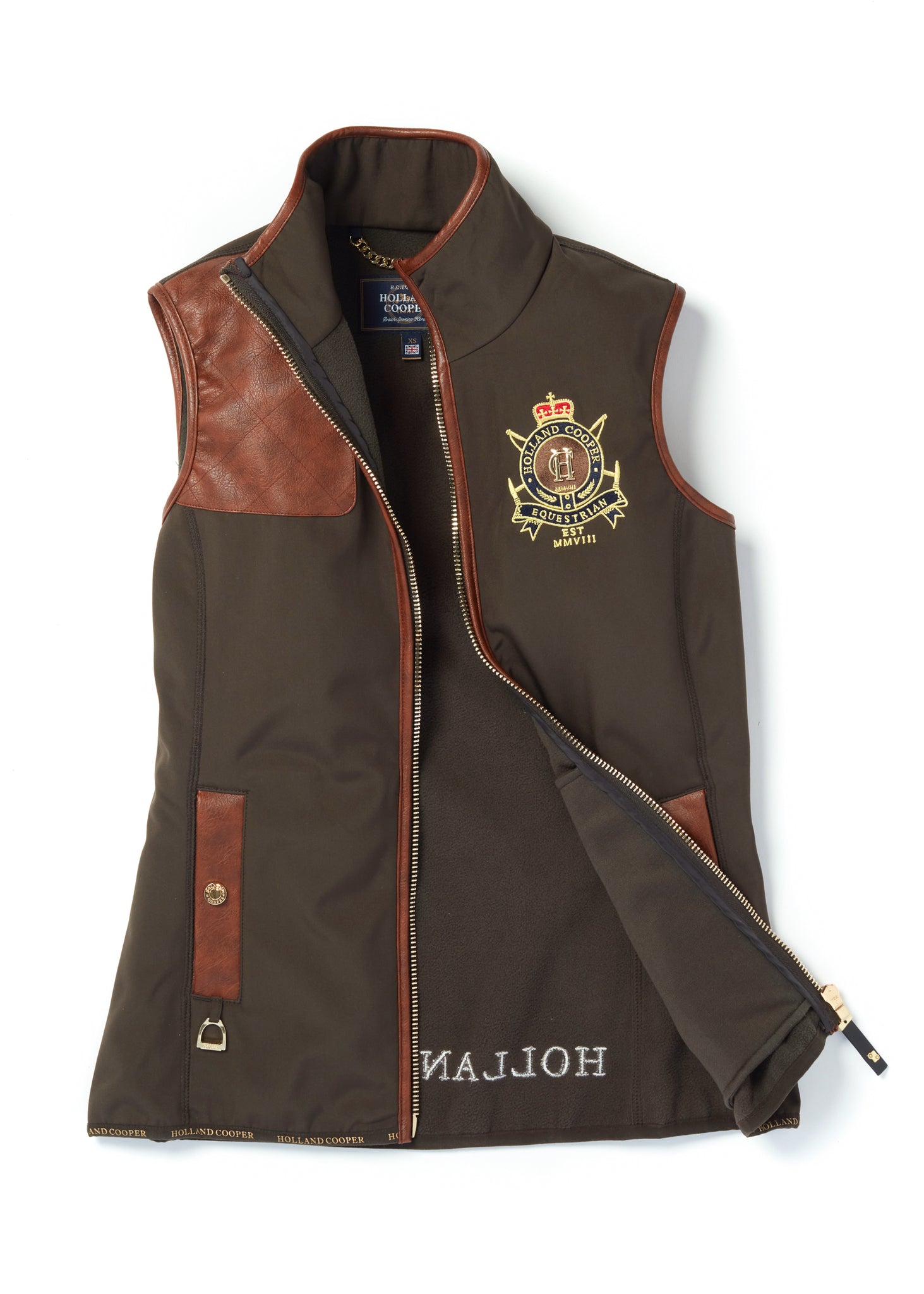 womens khaki gilet with dark brown leather seams along the arm holes pockets and down the zip with a gun patch on the shoulder and an embroidered logo