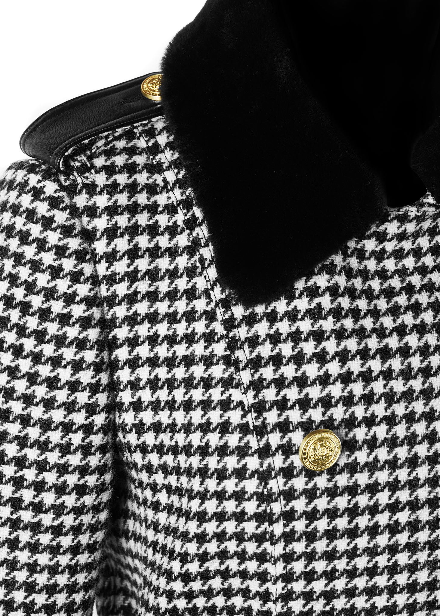 Faux black fur collar detail on womens black and white houndstooth double breasted full length trench coat with black faux fur collar and cuffs