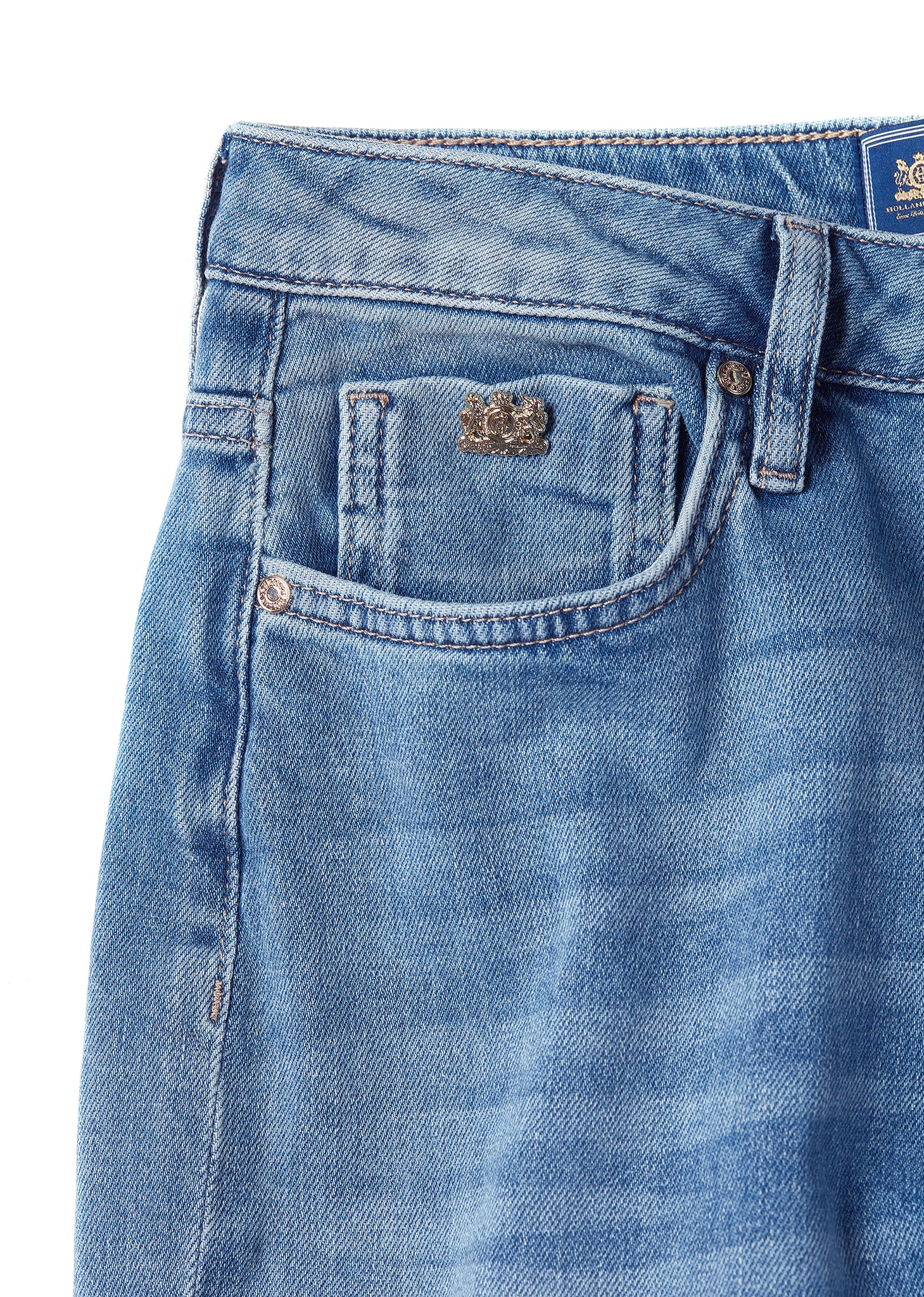 front pocket detail on womens high rise blue denim jogger style slim fit jean with cuffed ankles and two open pockets to the front and back 