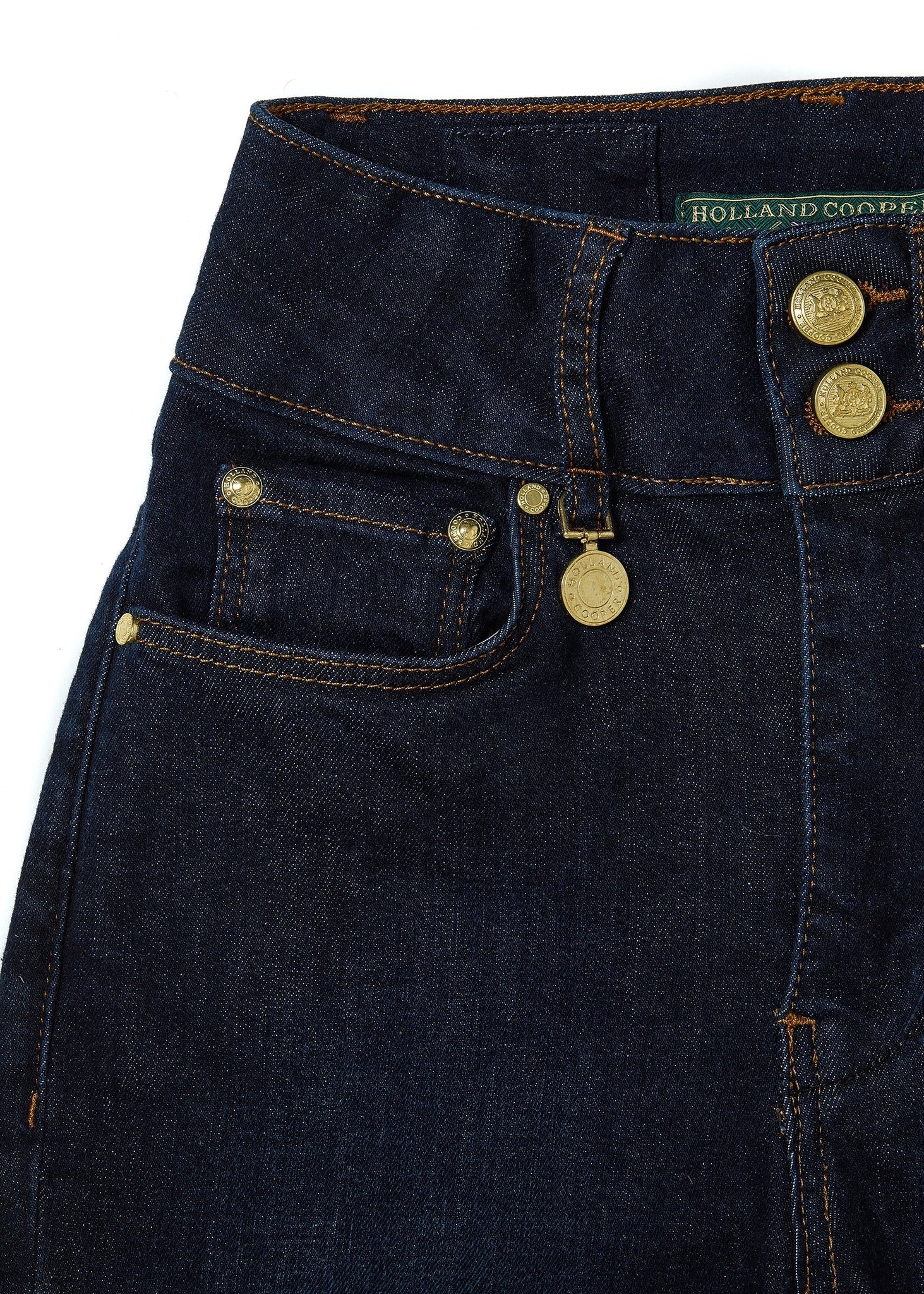 front pocket detail on womens high rise dark blue denim flared jean with centre front zip fly fastening with two open pockets at the front and back with gold hardware on back waistband 