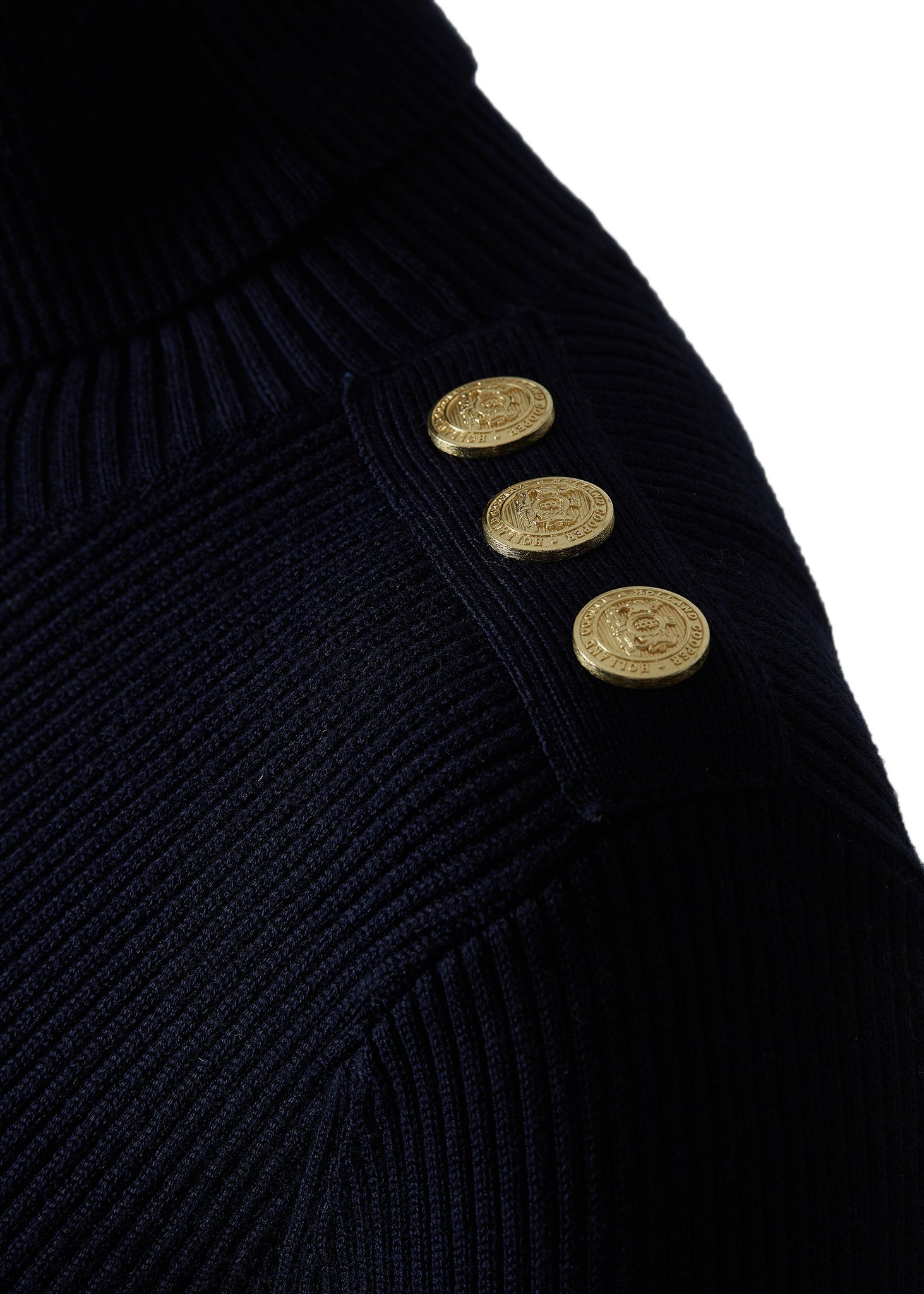 gold button shoulder detail of womens body-contouring navy knitted midi dress with ribbed roll neck and cuffs and gold buttons on shoulders and cuffs