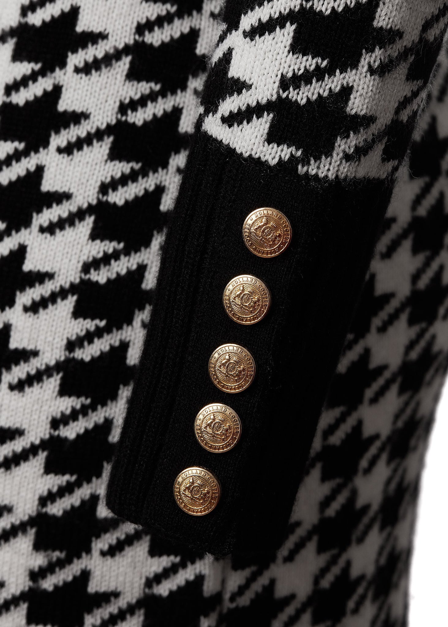 gold button details on cuffs of womens black and white houndstooth roll neck jumper dress with contrast black cuffs and ribbed hem 