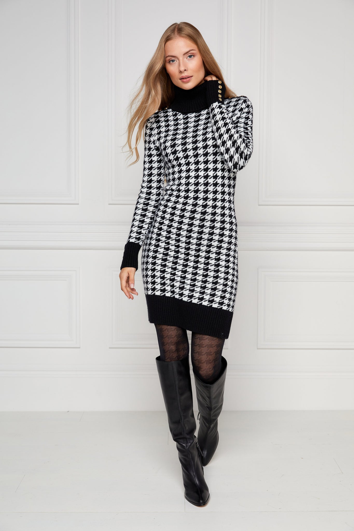 womens black and white houndstooth roll neck jumper dress with contrast black cuffs and ribbed hem with gold button detail on the cuffs and shoulders