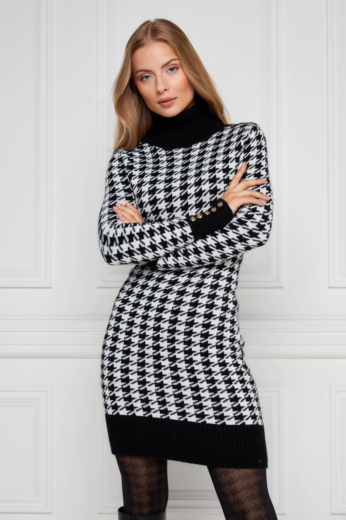 womens black and white houndstooth roll neck jumper dress with contrast black cuffs and ribbed hem with gold button detail on the cuffs and shoulders