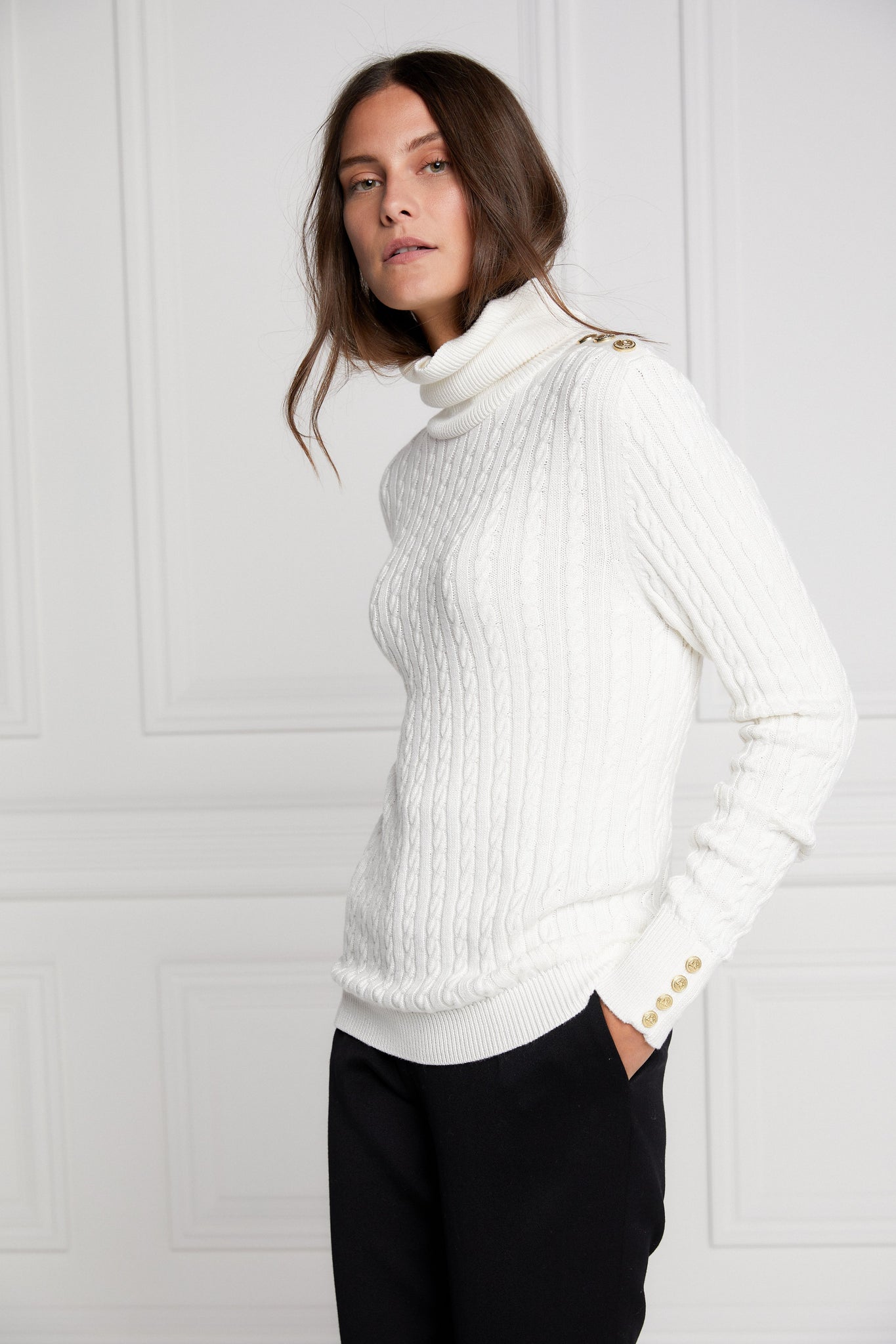 womens cable knit jumper in white with ribbed roll neck cuffs and hem