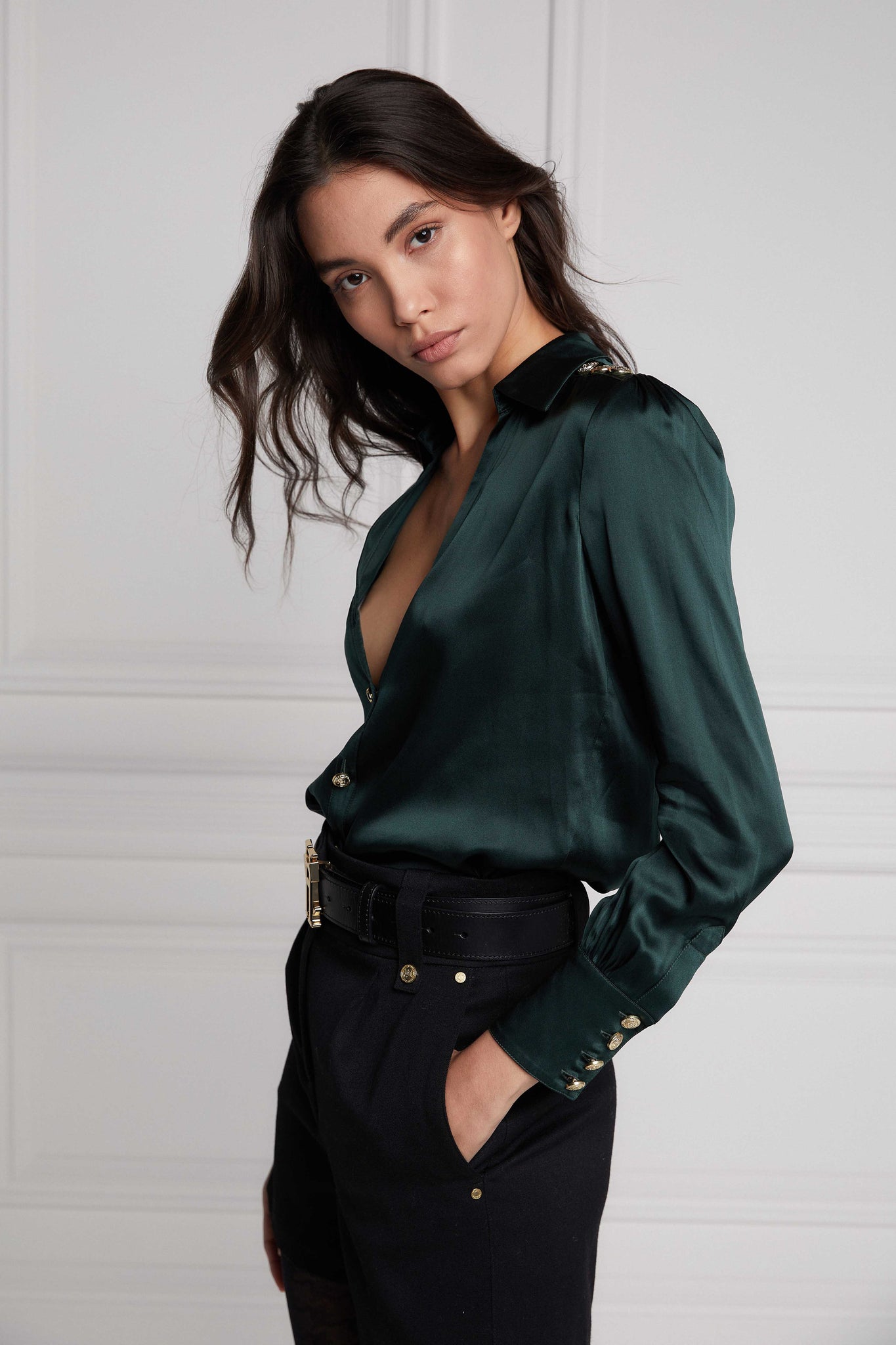 side of womens long sleeve dark green silk v neck blouse with gold buttons