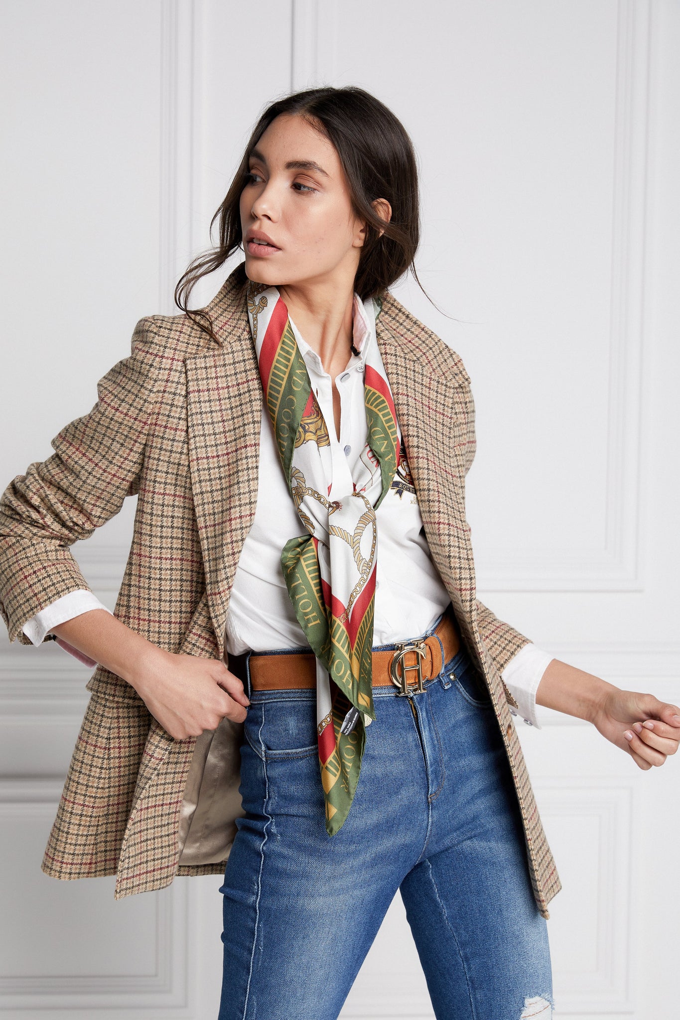 womens classic slim fit single breasted blazer in camel black and red with lower patch pockets with concealed button flap and horn button finish on cuffs and front  worn with a white shirts classic indigo distressed jeans and green and red printed silk scarf