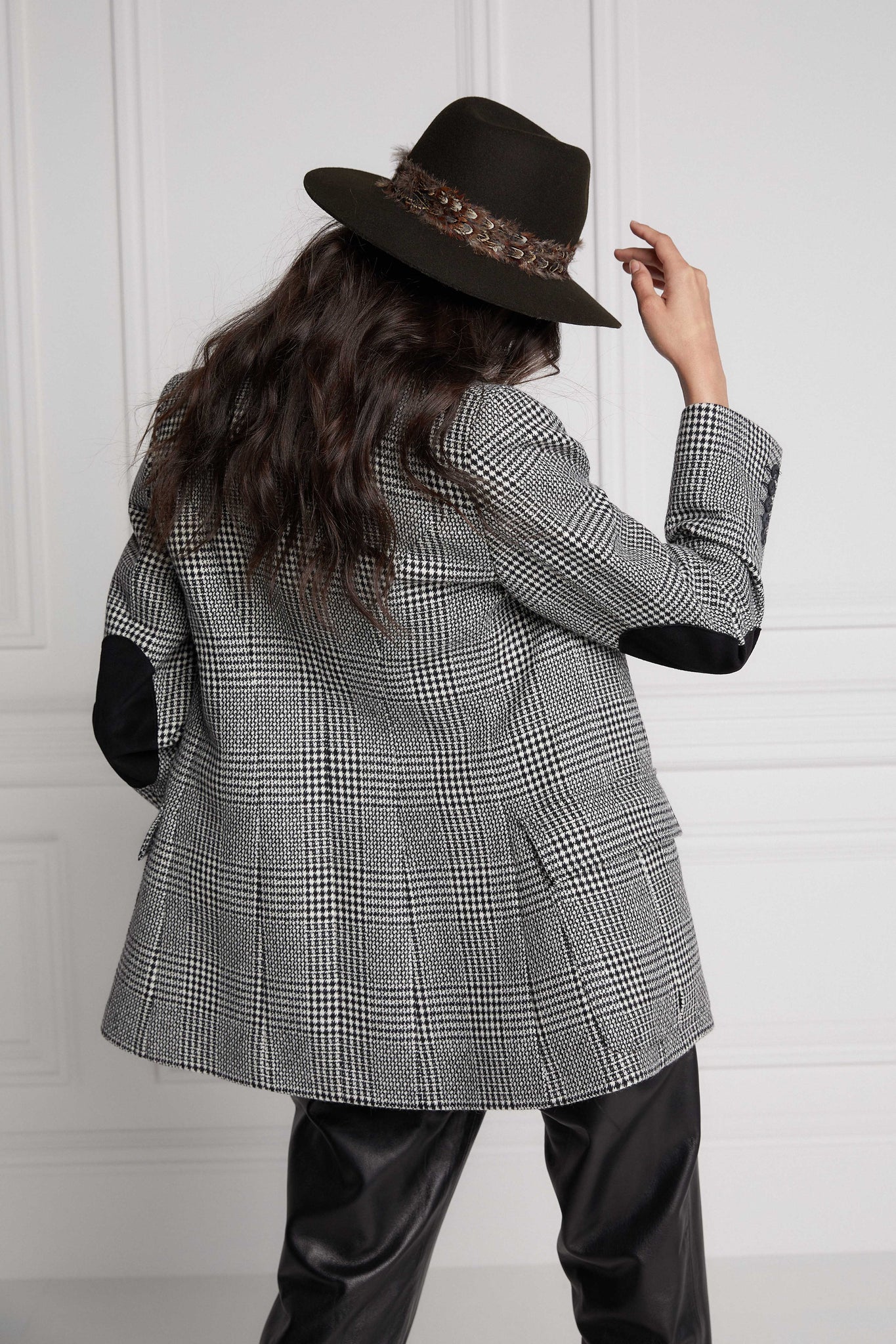 back of womens tailored fit single breasted blazer in black and white check with patch pockets and contrast black suede elbow patches and underside collar