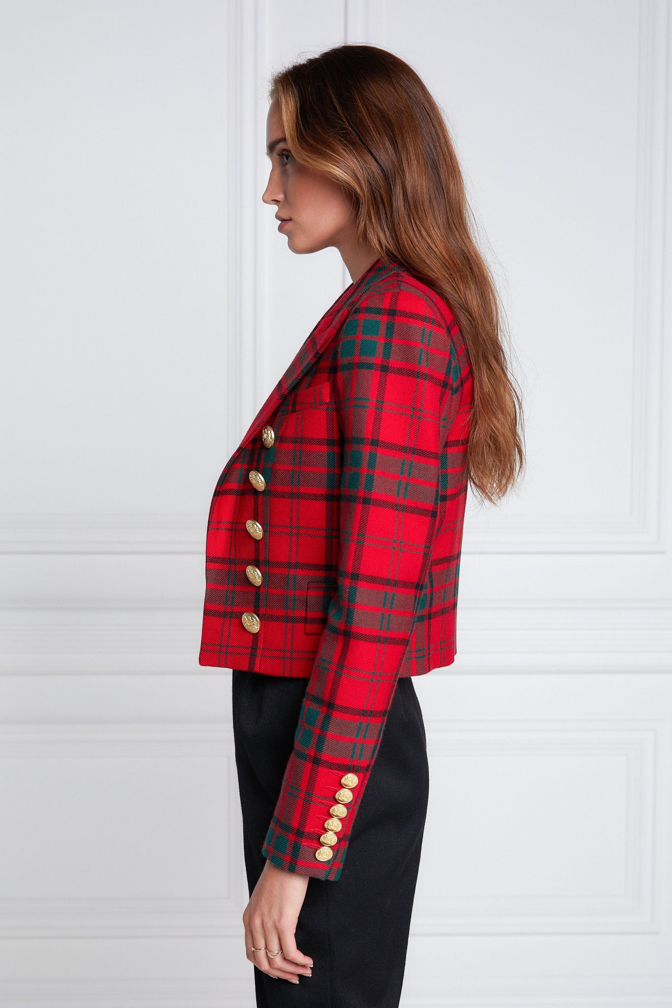 side of British made tailored cropped jacket in red and green tarten with welt pockets and gold button detail down the front