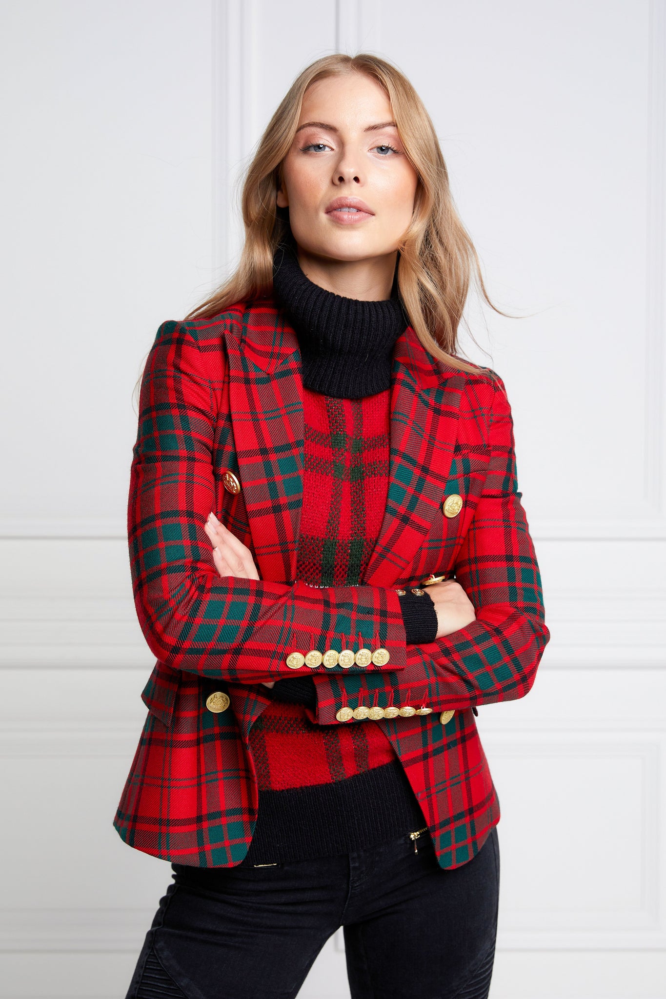 British made double breasted blazer that fastens with a single button hole to create a more form fitting silhouette with two pockets and gold button detailing this blazer is made from red and green tartan