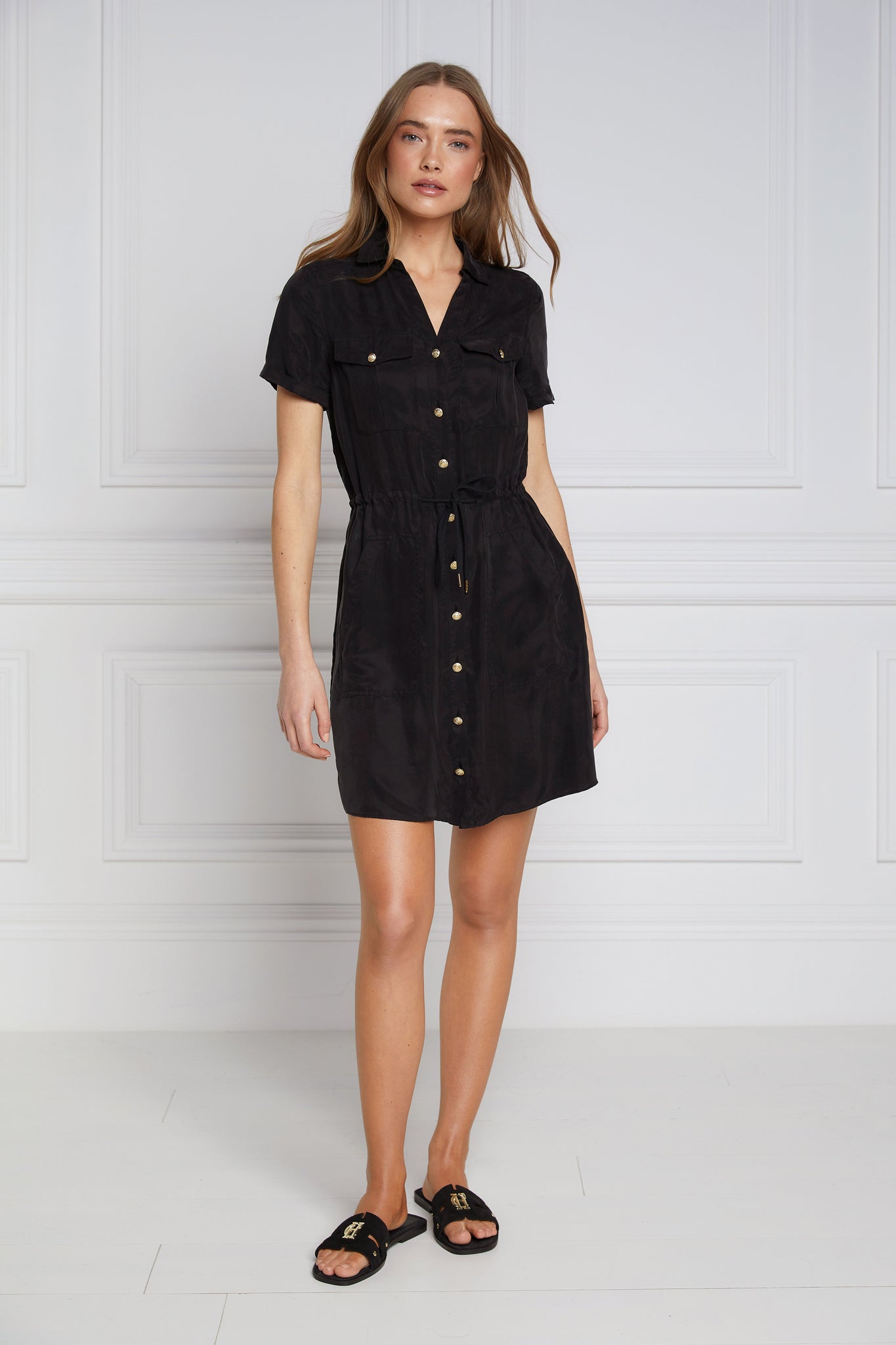 womens black military mini shirt dress with drawcord tie around the waist and gold buttons down the front and black sliders