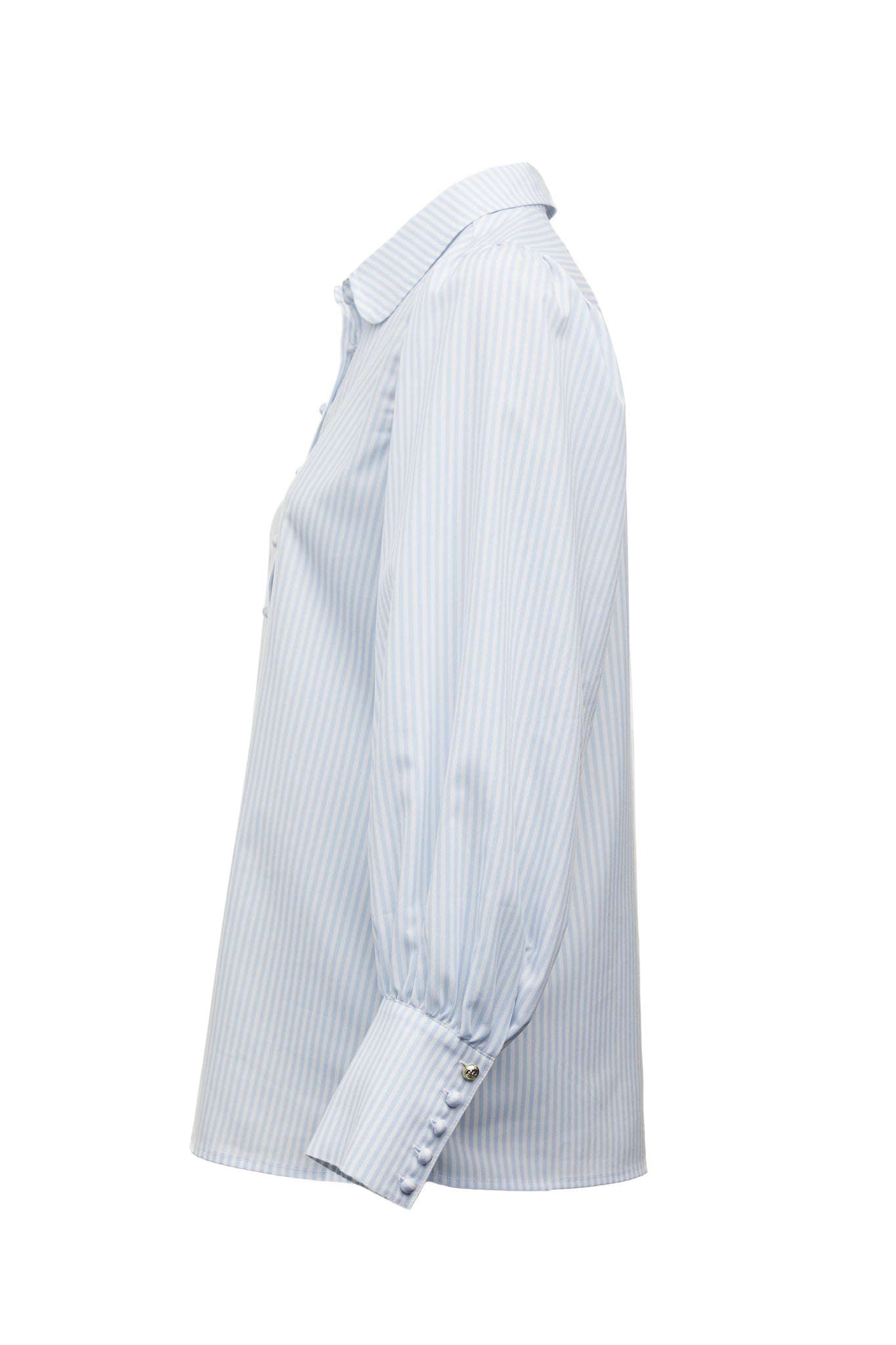 side image of classic fitted shirt with long sleeves and subtle puffy shoulders with thin blue and white stipe print design with extra long cuffs and rounded collar detailed with fabric buttons 