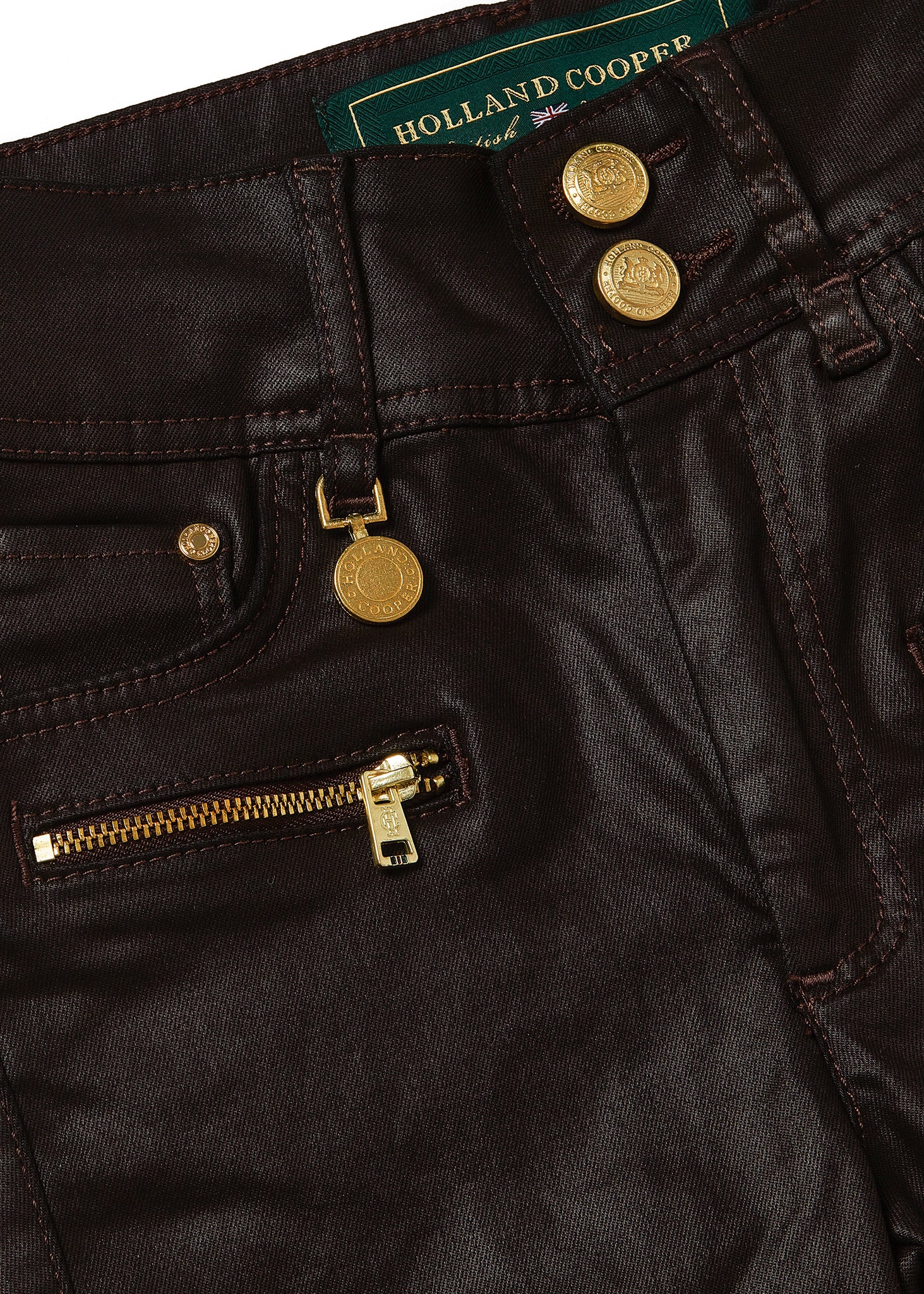 front pocket detail on womens high rise brown coated skinny jean for a waxed look with jodhpur style seams and two open zip pockets to the front with HC branded pulls