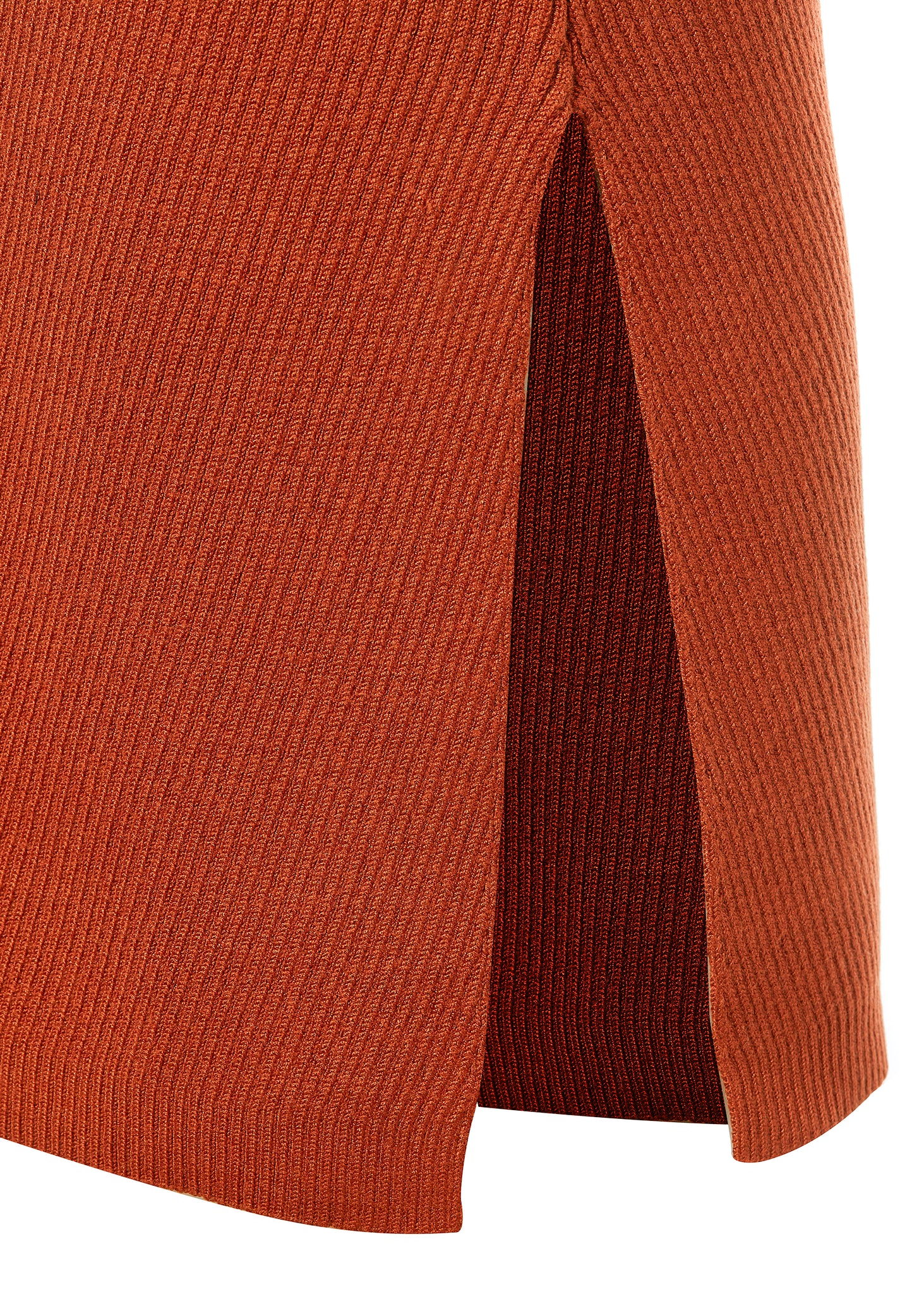 detailed shot of side slit on womens ribbed orange v neck midi dress with gold buttons on shoulder and tan leather sliders