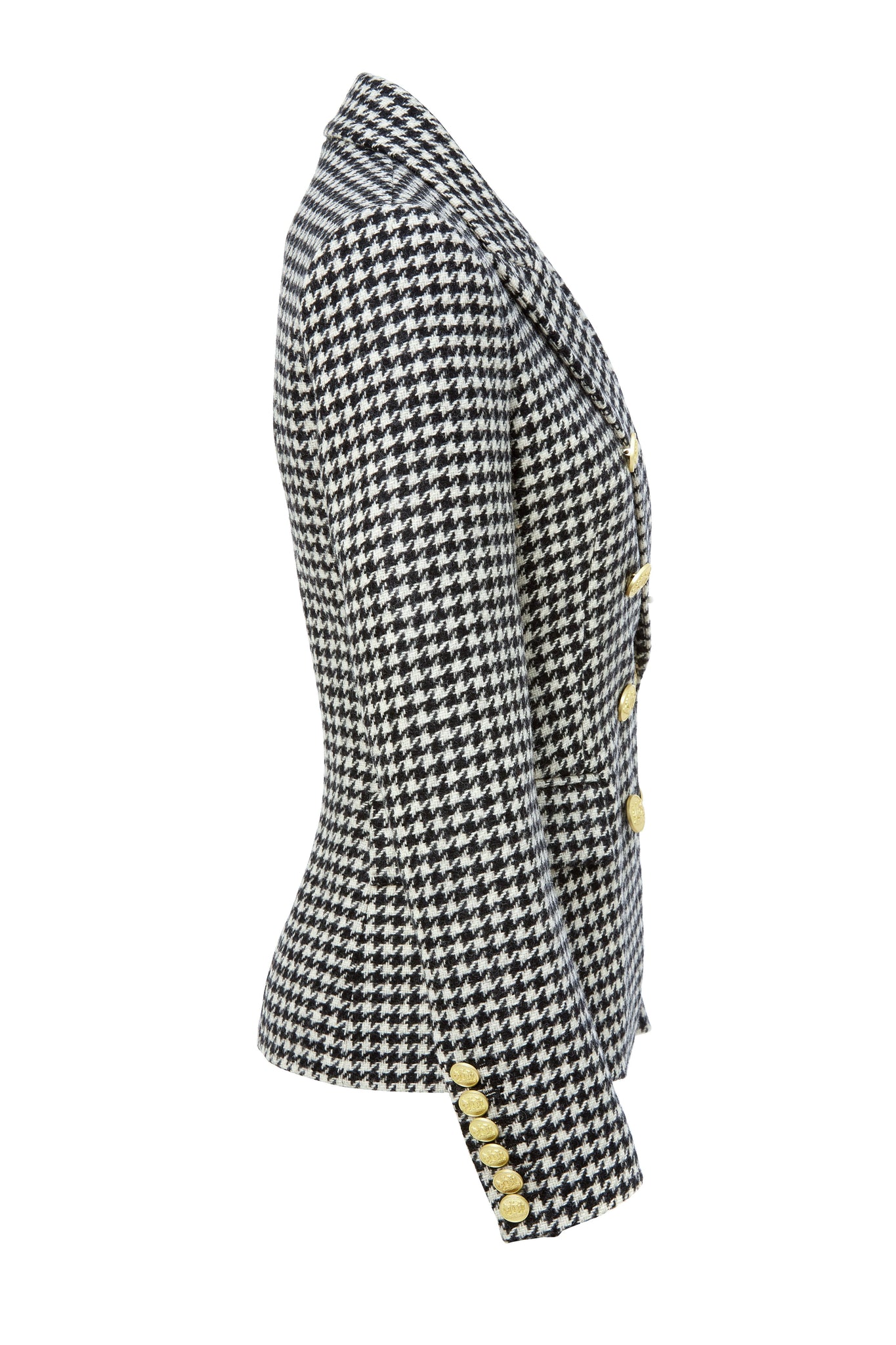 side of British made double breasted blazer that fastens with a single button hole to create a more form fitting silhouette with two pockets and gold button detailing this blazer in black and white houndstooth