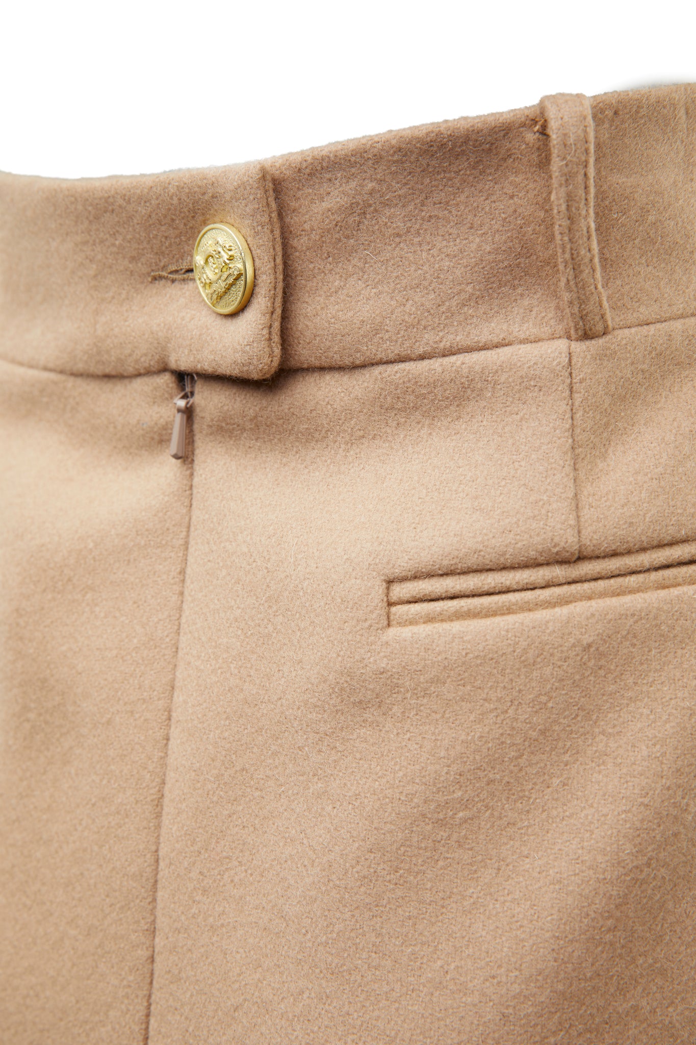 gold button detail on back waistband of womens camel wool pencil mini skirt with concealed zip fastening on centre back and gold rivets down front