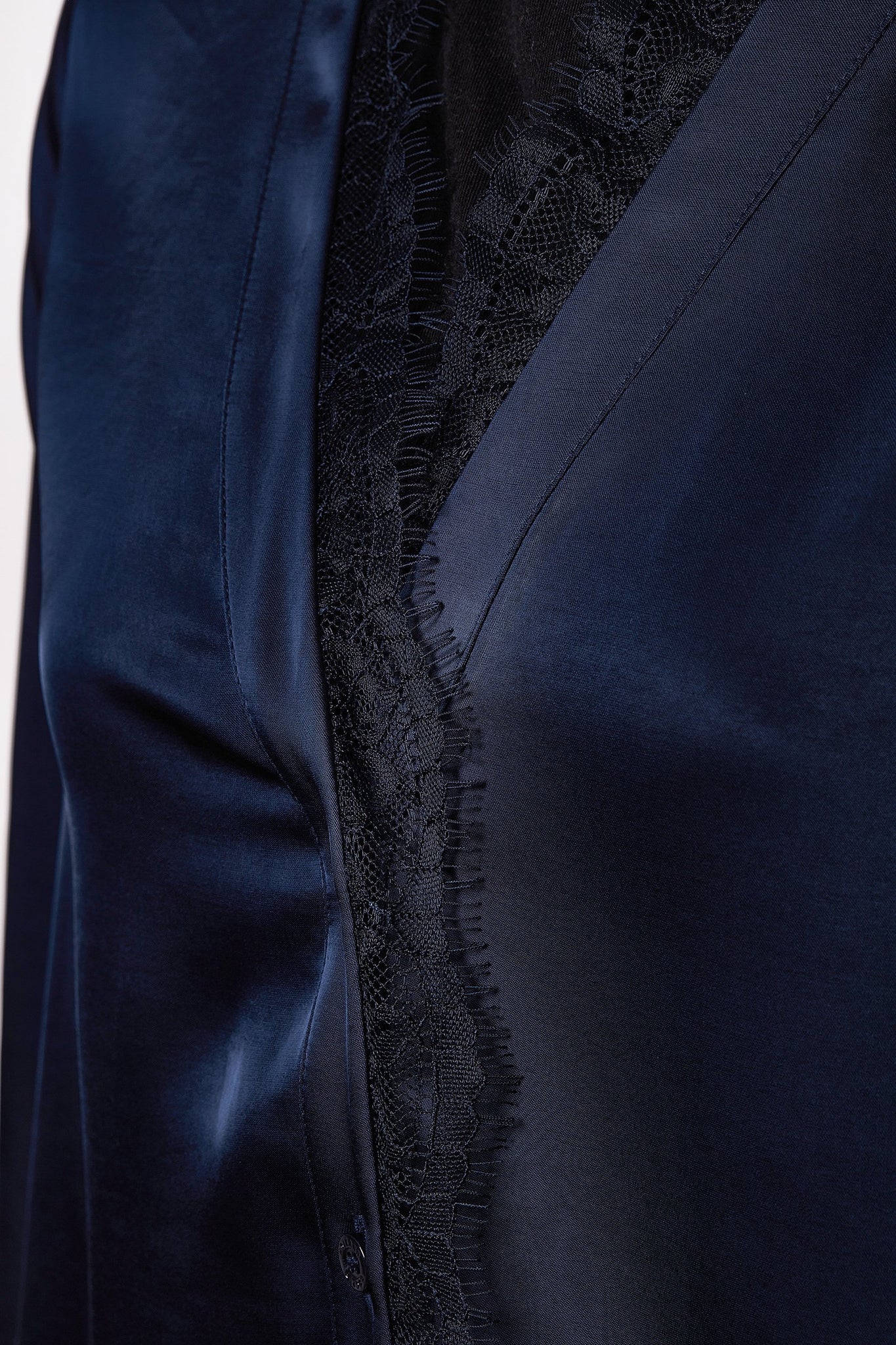 lace hem detail on womens blue long sleeve silk v neck blouse with black lace hem details
