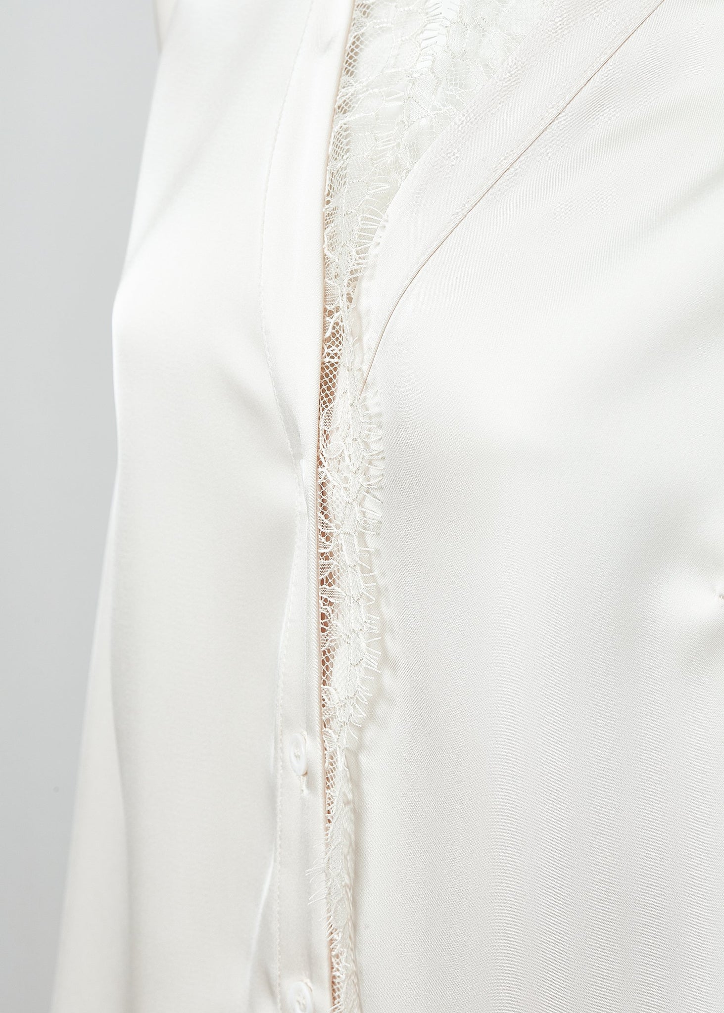 lace detail on womens white long sleeve silk v neck blouse with white lace hem details