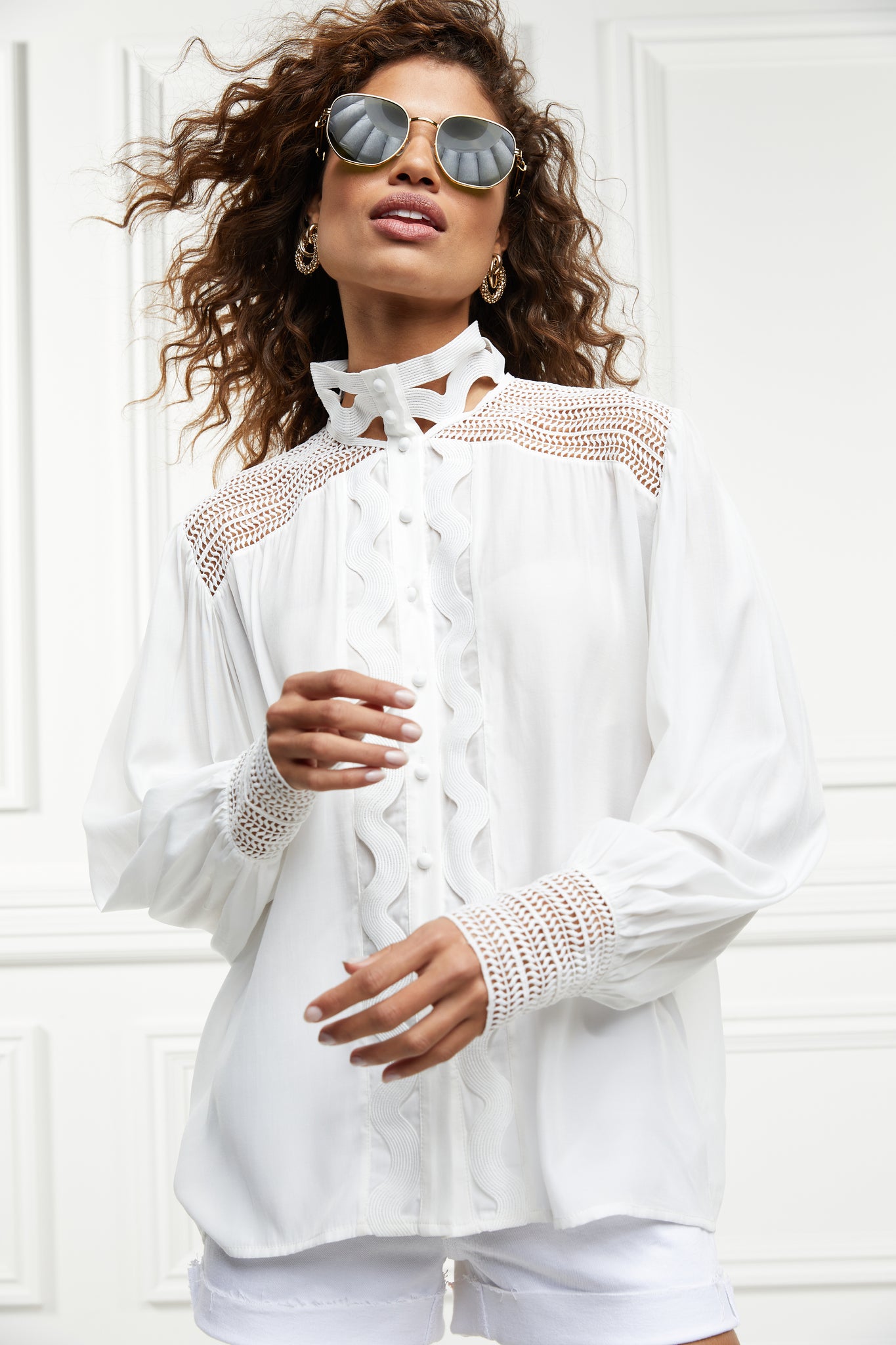 womens white polyester shirt with lace detail to the collar shoulders and arm cuffs and balloon sleeve and womens white denim short