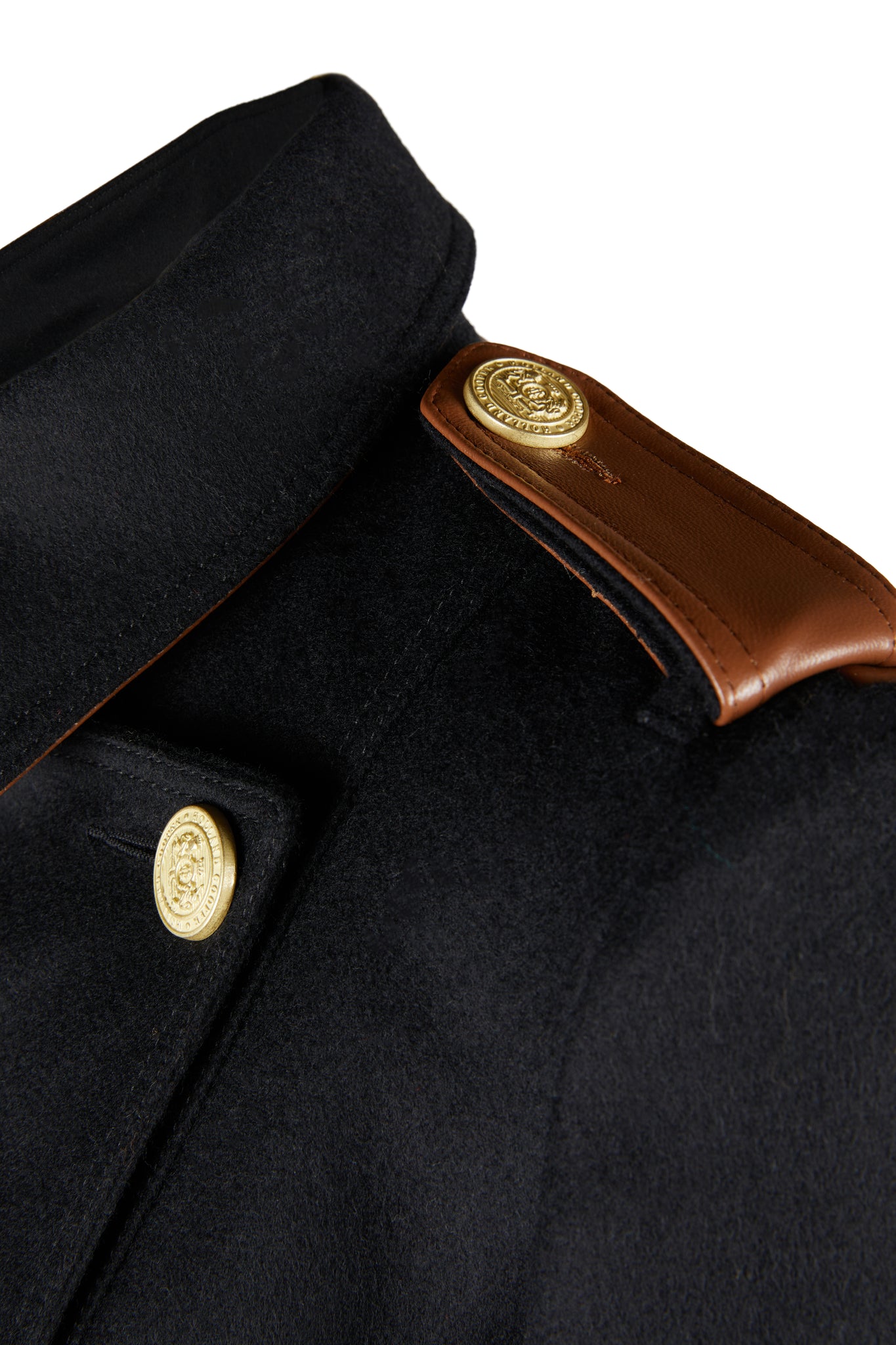 Shoulder detail of Womens black and tan brown leather detailed with gold hardware knee length wool trench coat