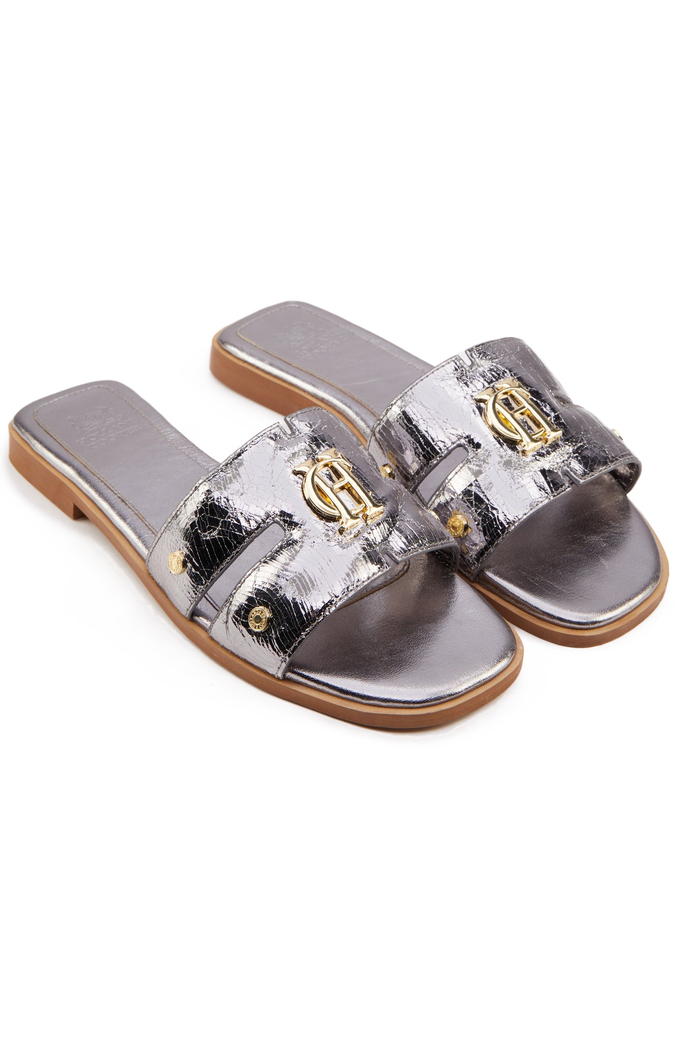 Silver leather sliders with crackled effect and a tan leather sole and gold hardware