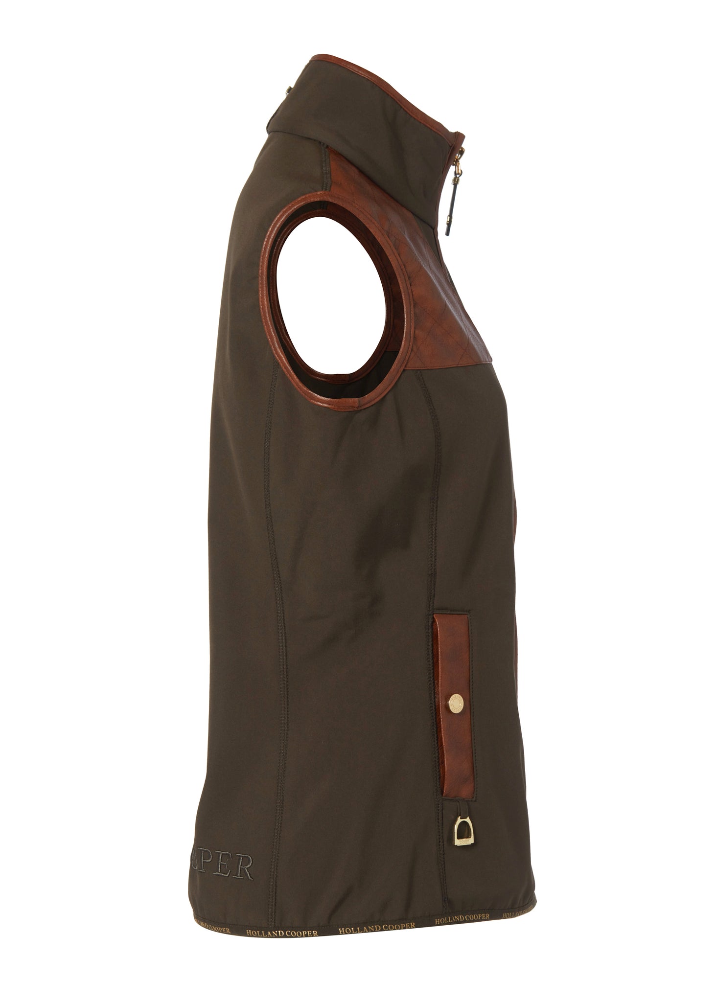 side of womens khaki gilet with dark brown leather seams along the arm holes pockets and down the zip with a gun patch on the shoulder and an embroidered logo