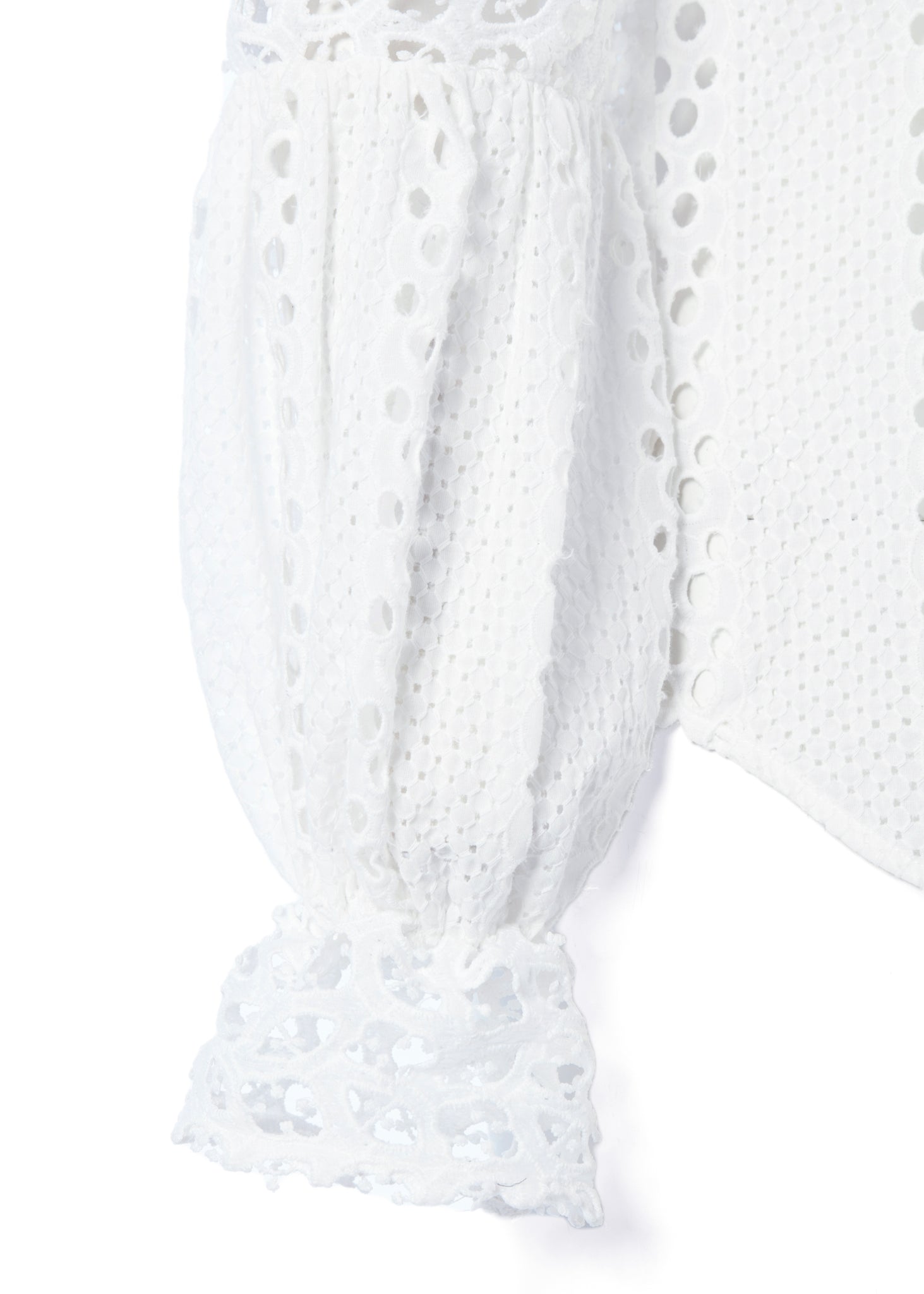 cuff detail on womens long sleeve white cotton broderie anglaise shirt with voluminous sleeves and front buttons 