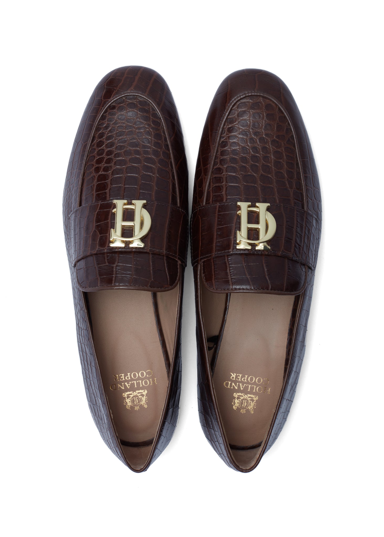 birds eye view of brown croc embossed leather loafers with a slightly pointed toe and gold hardware to the top and gold foil branding on the inner sole