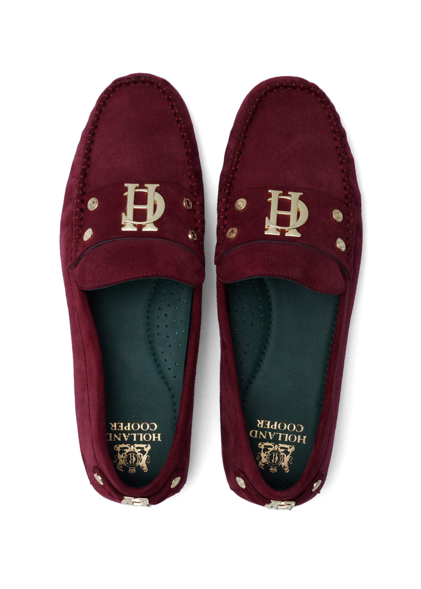 classic deep red suede loafers with a leather sole and top stitching details and gold hardware with a dark green inner sole