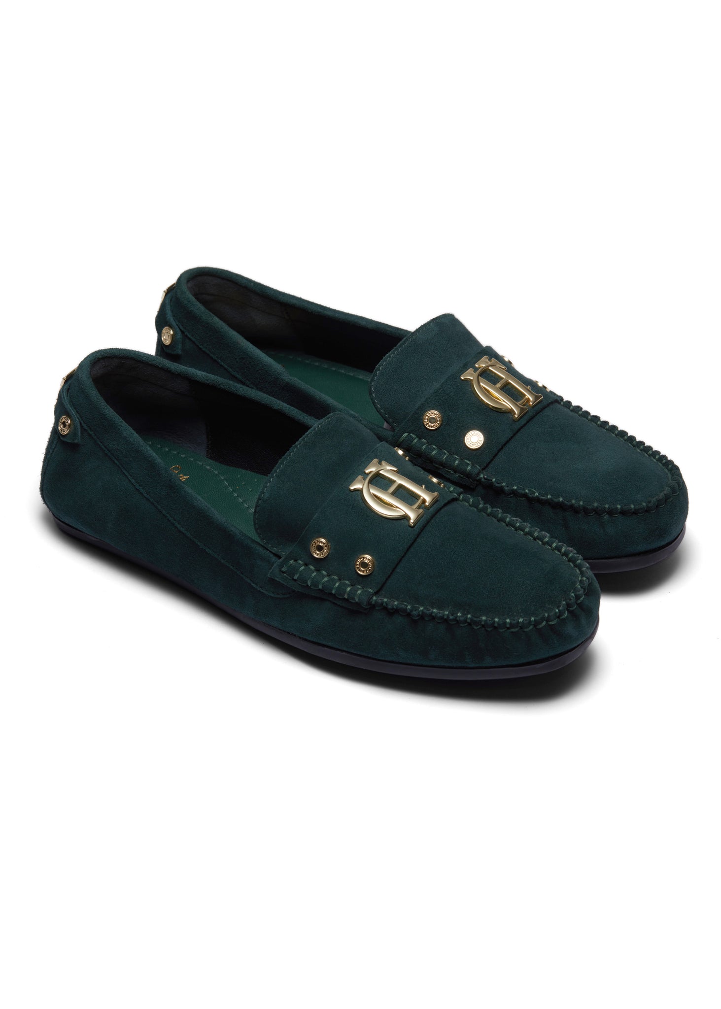 classic emerald green suede loafers with a leather sole and top stitching details and gold hardware with a dark green inner sole
