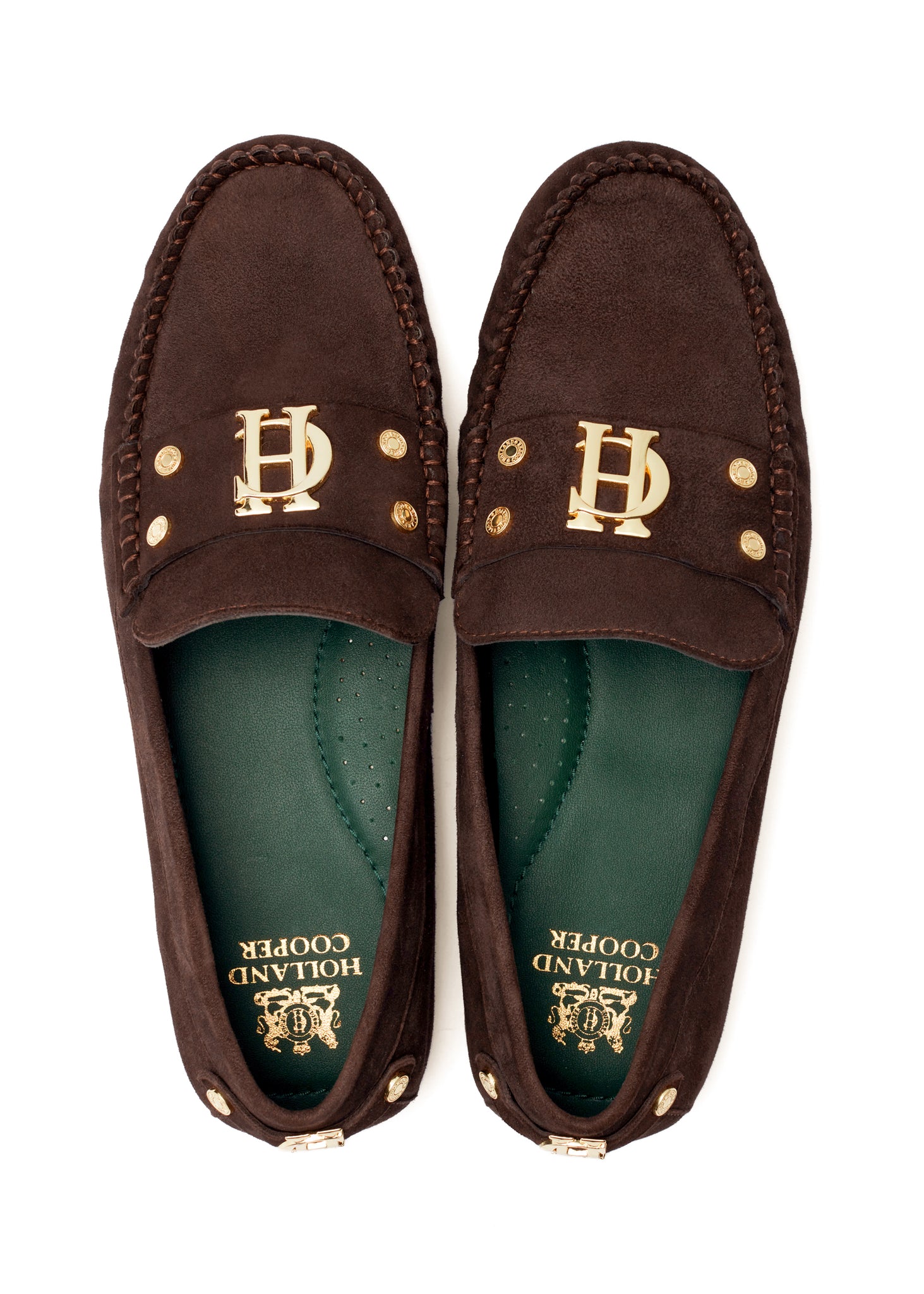    Classic brown suede loafers with a leather sole and top stitching details and gold hardware with a dark green inner sole and gold foil branding 