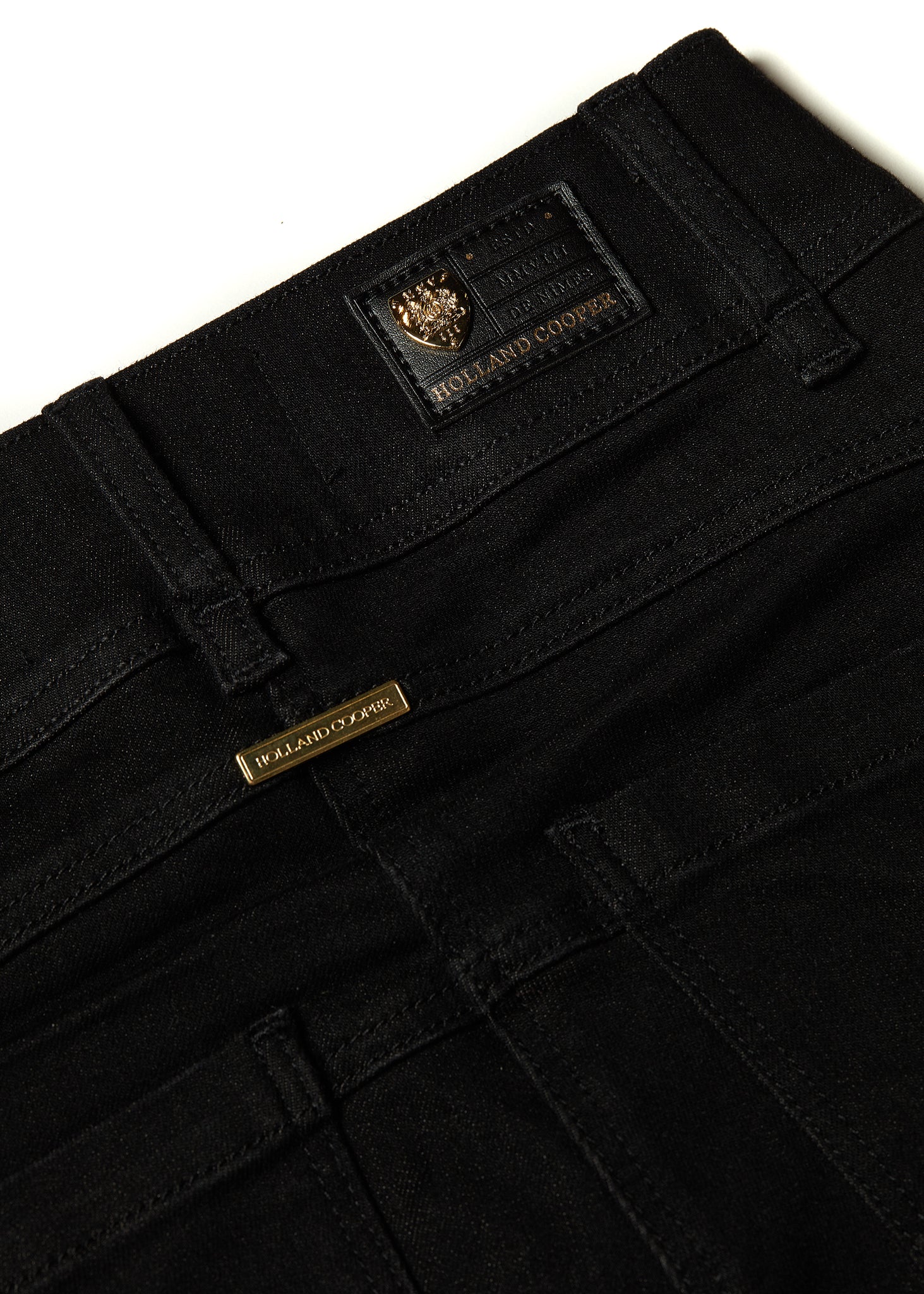 gold hardware detail on back of womens high rise black denim skinny stretch thermal jean with jodhpur style seams and two open pockets to the front and back with internal fleece lining and hc gold crest on front right pocket