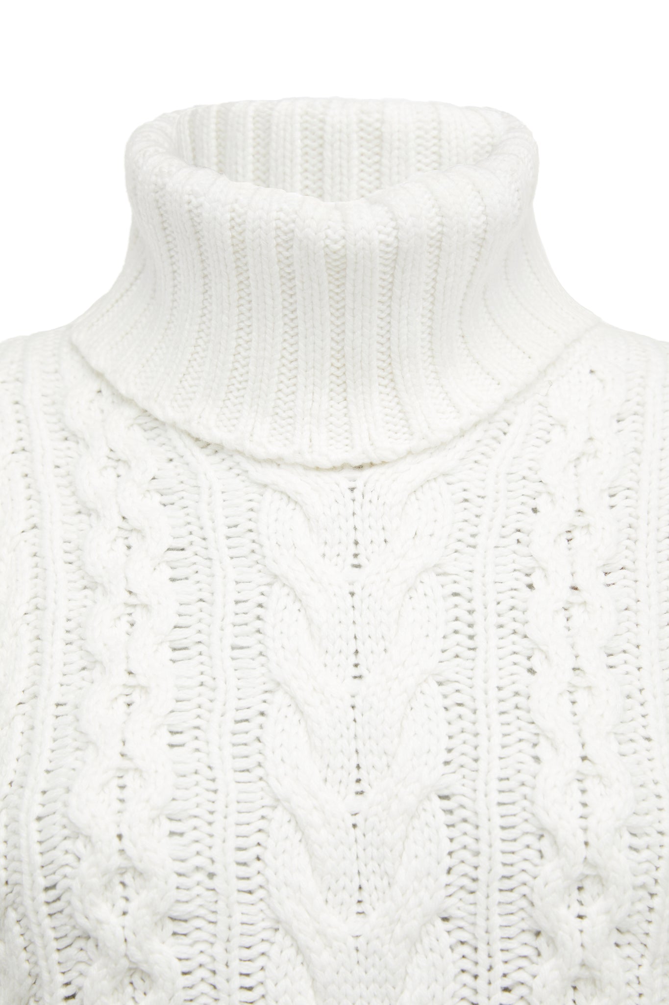 Roll neck detail of sleeveless white chunky knit cable jumper with ties at each side 
