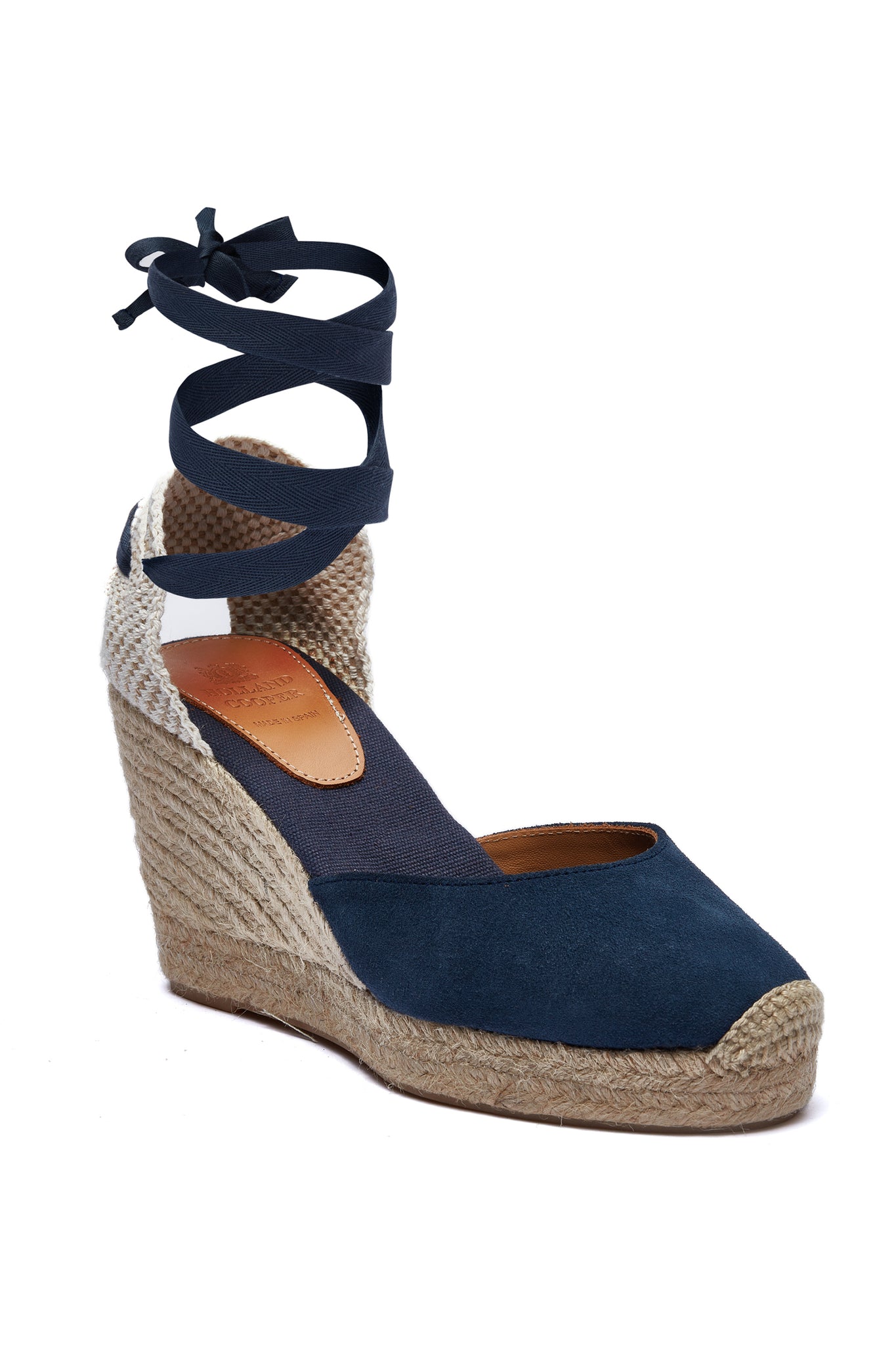 4 inch braided jute wedge heel with navy suede top and tie up navy ribbons around the ankle.
