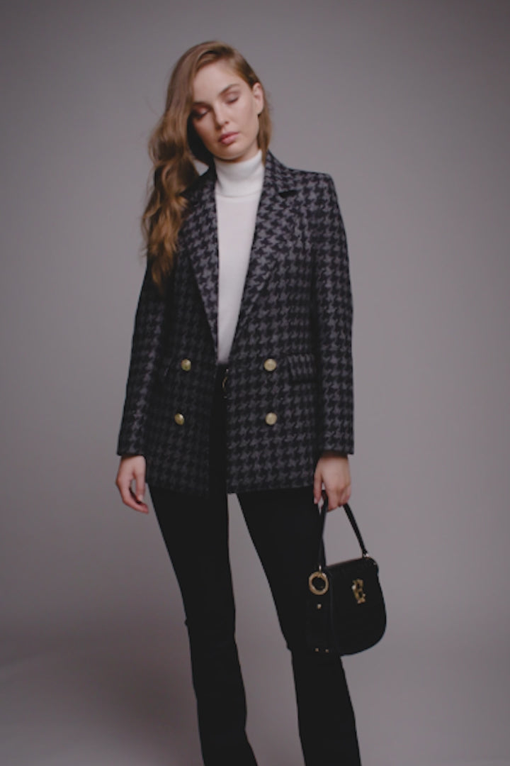 double breasted wool blazer in grey and black large scale houndstooth with two hip pockets and gold button details down front and on cuffs and handmade in the uk
