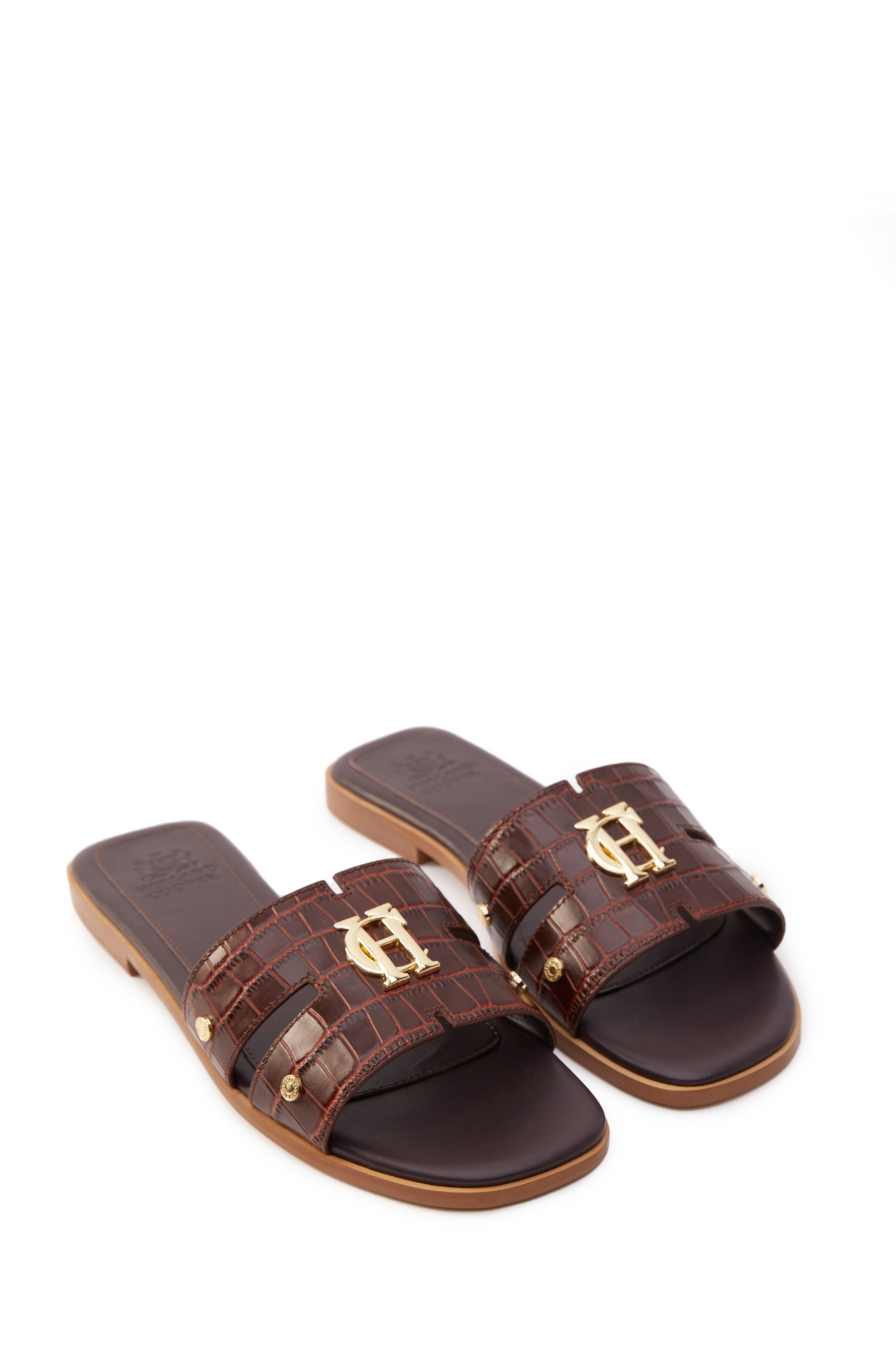 Brown croc embossed leather sliders with a tan leather sole and gold hardware