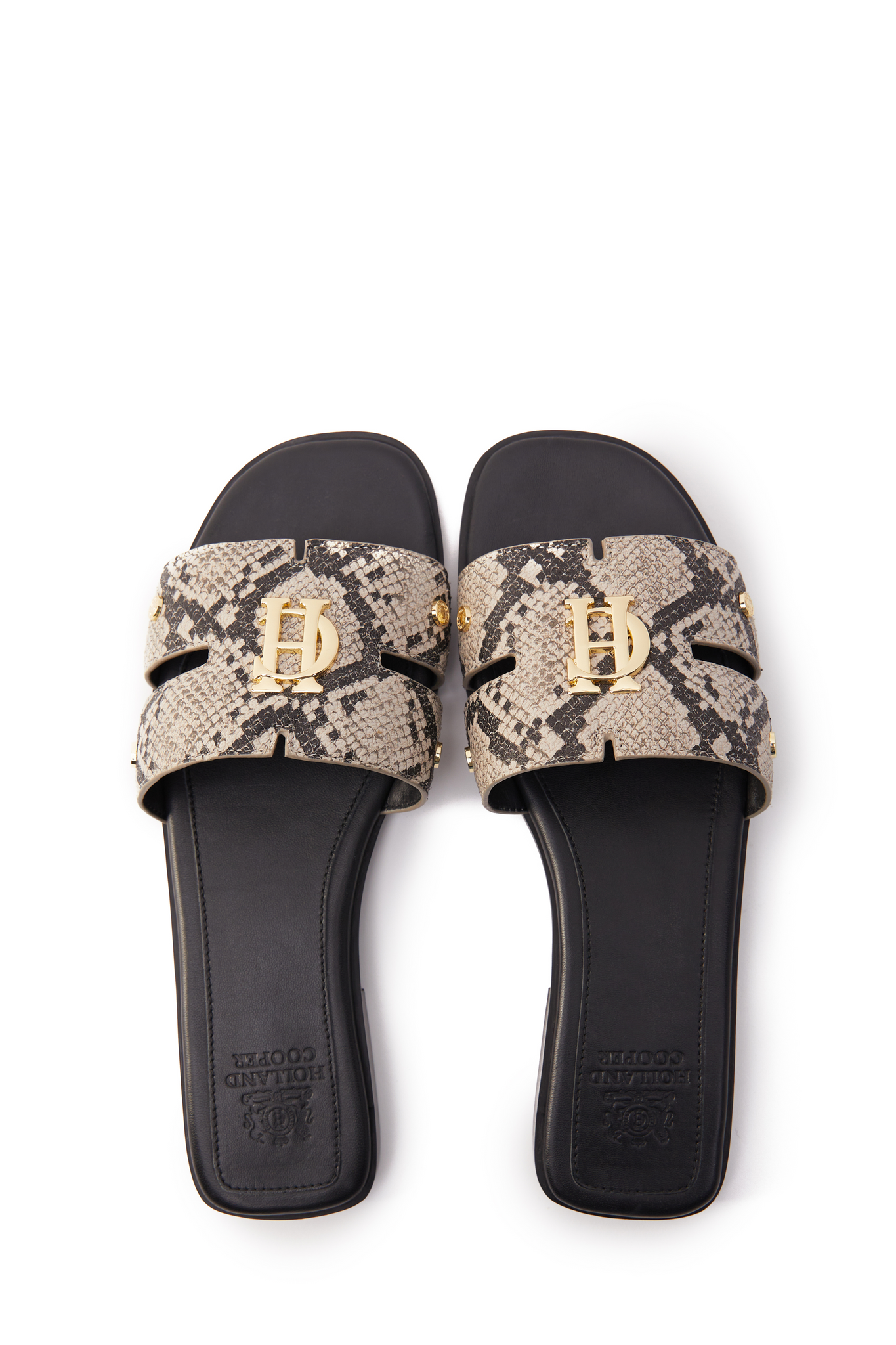 Birds eye view of snake print embossed leather sliders with a black leather sole and gold hardware