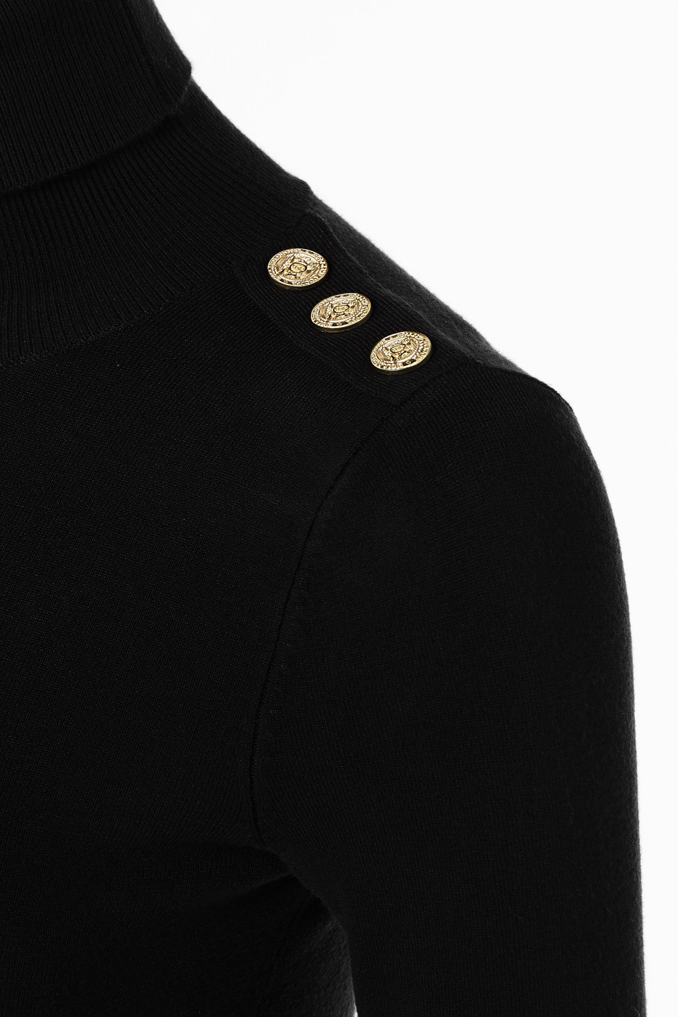 gold button detail across shoulders of super soft lightweight jumper in black with ribbed roll neck collar, cuffs and hem