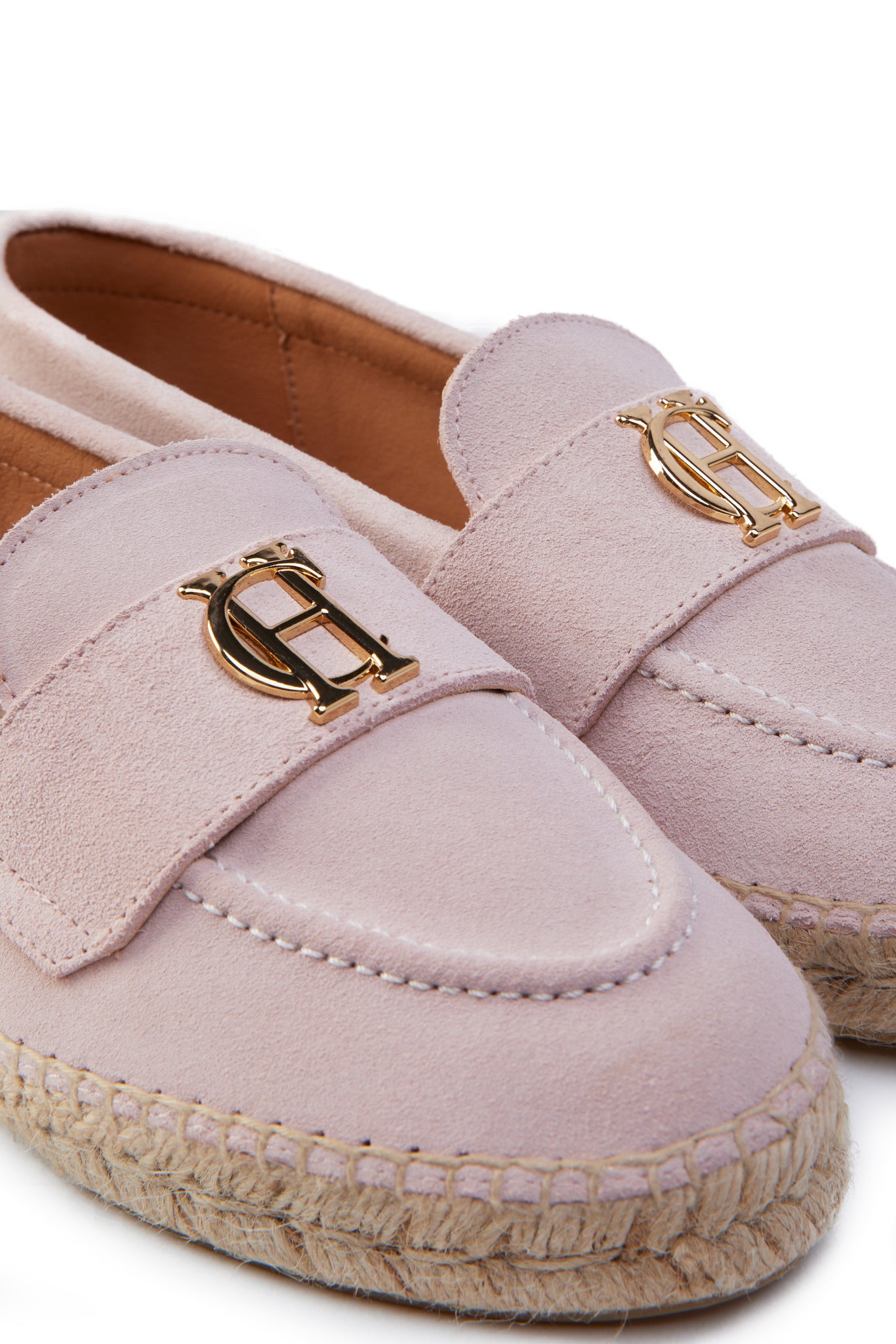 Close up of gold hardware on light pink suede classic espadrille with plaited jute sole 